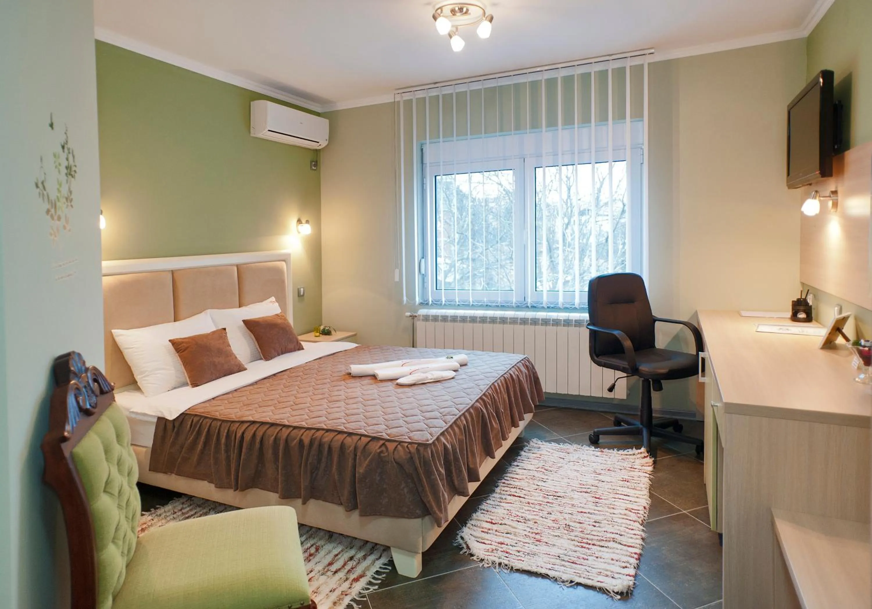 Bed in Garni Hotel Lama