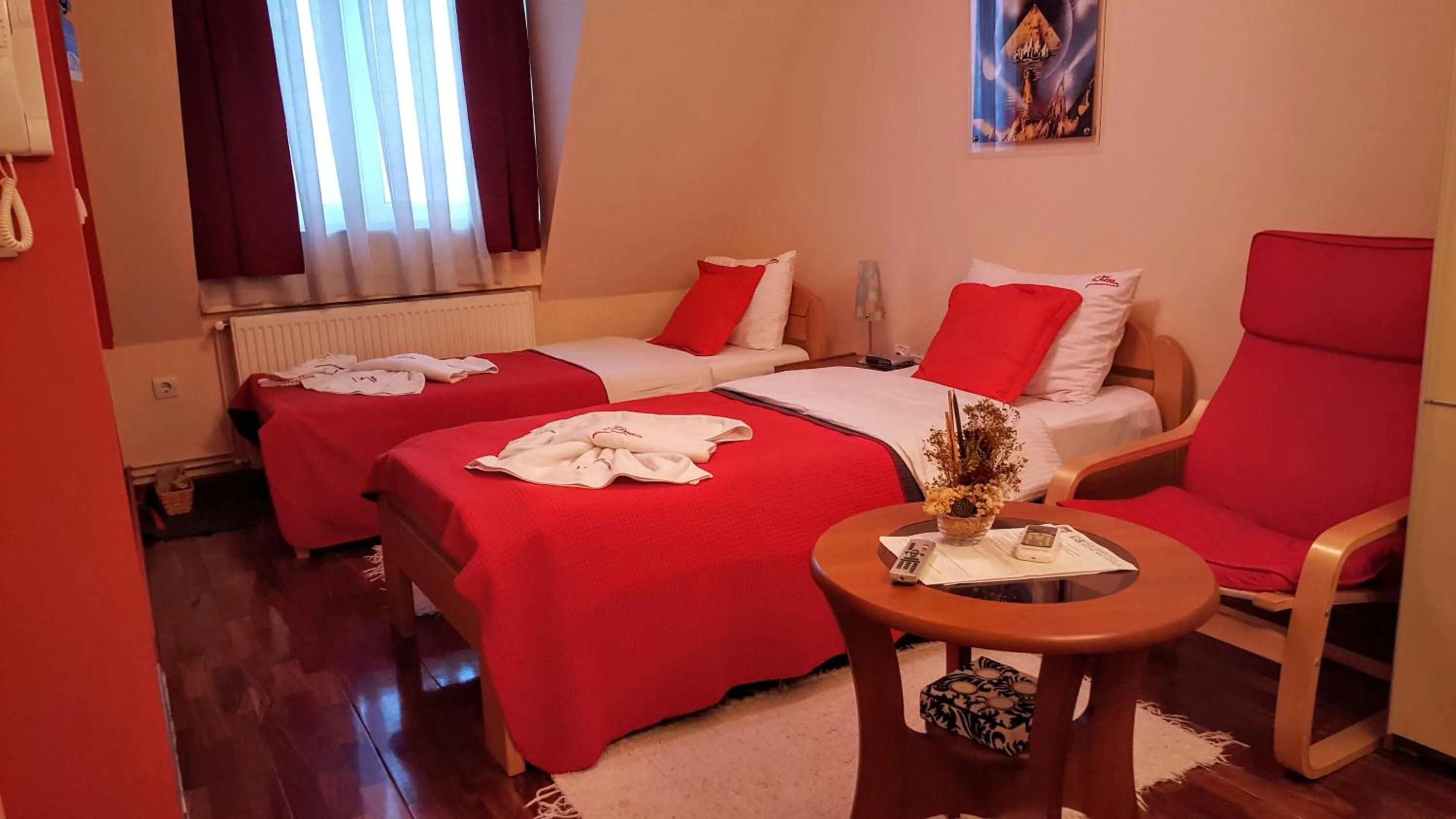 Bed in Garni Hotel Lama