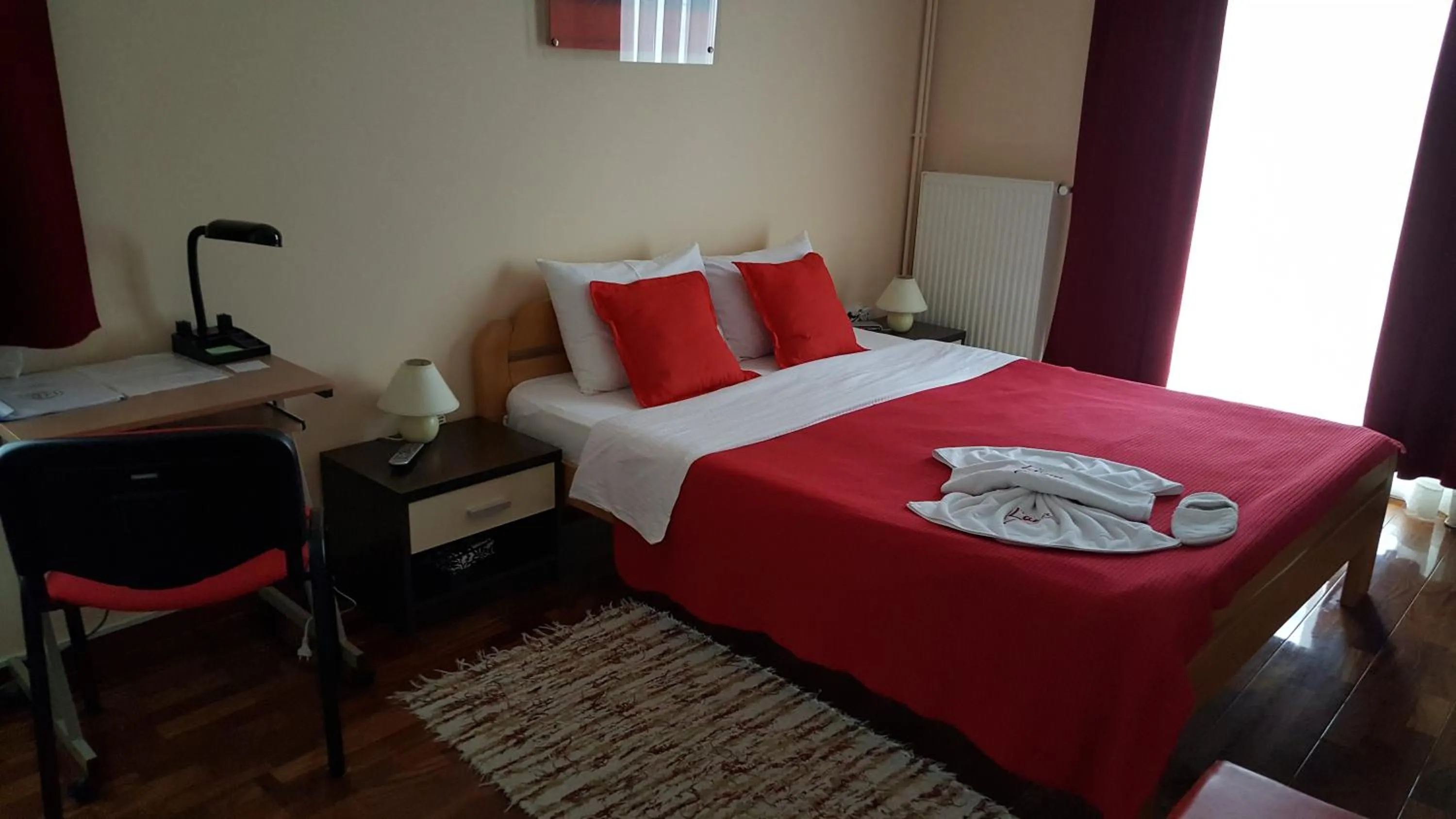 Bed in Garni Hotel Lama