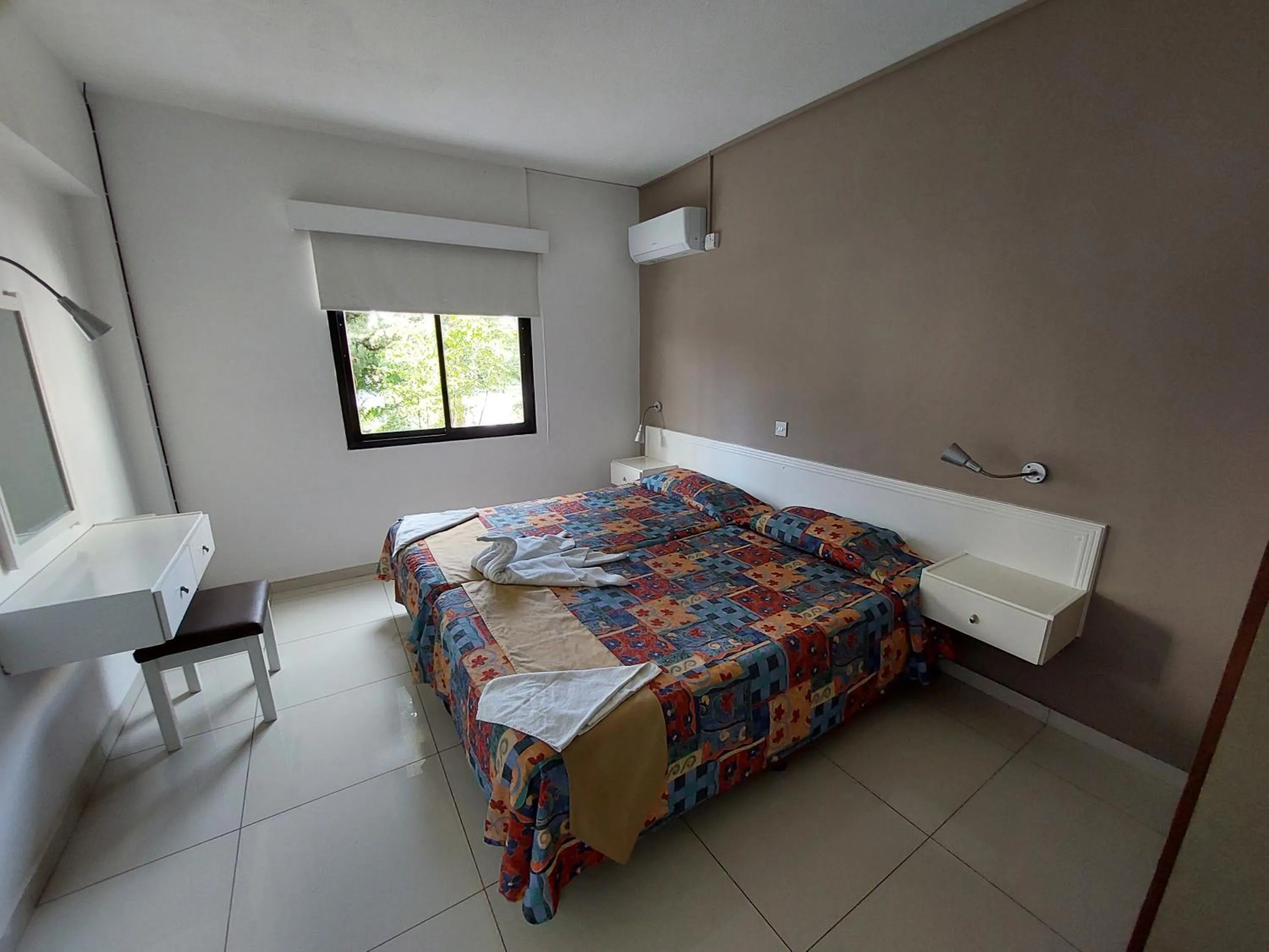 Bed in Hilltop Gardens Hotel Apartments