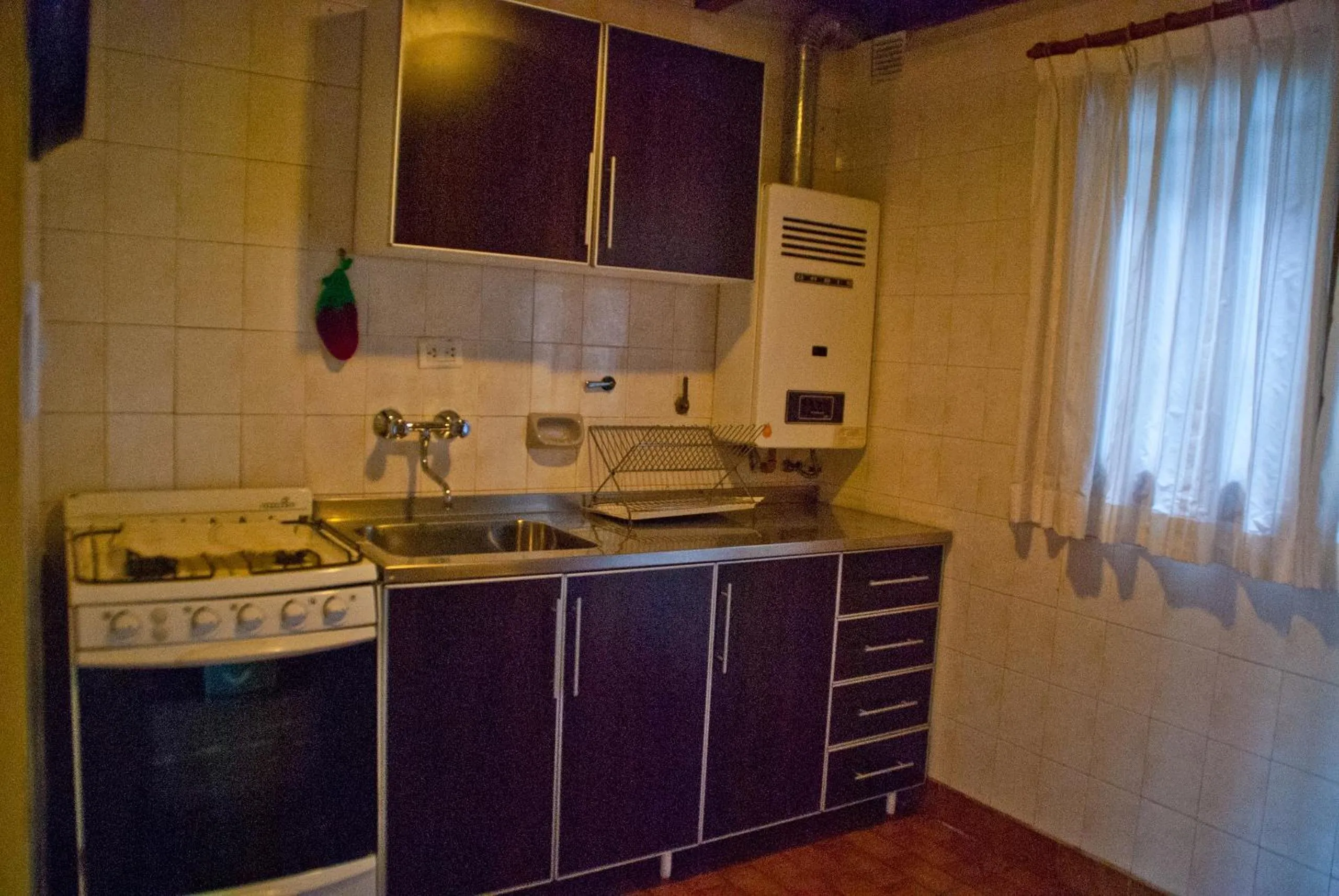 Kitchen or kitchenette in Cabañas Villa Pañil