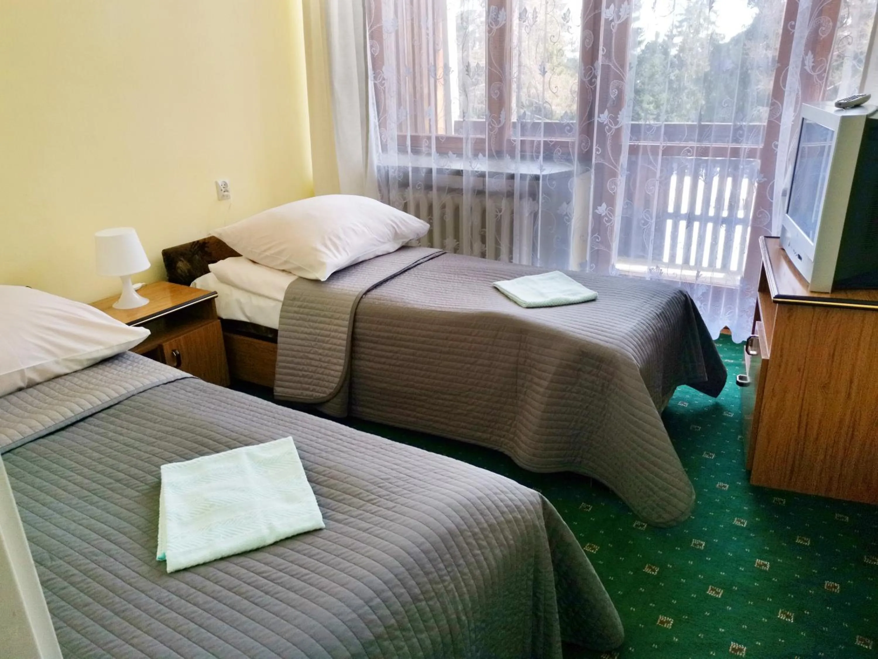 Bed in Zespół Tatry - Hotel Tatry i Budynek Turystyczny