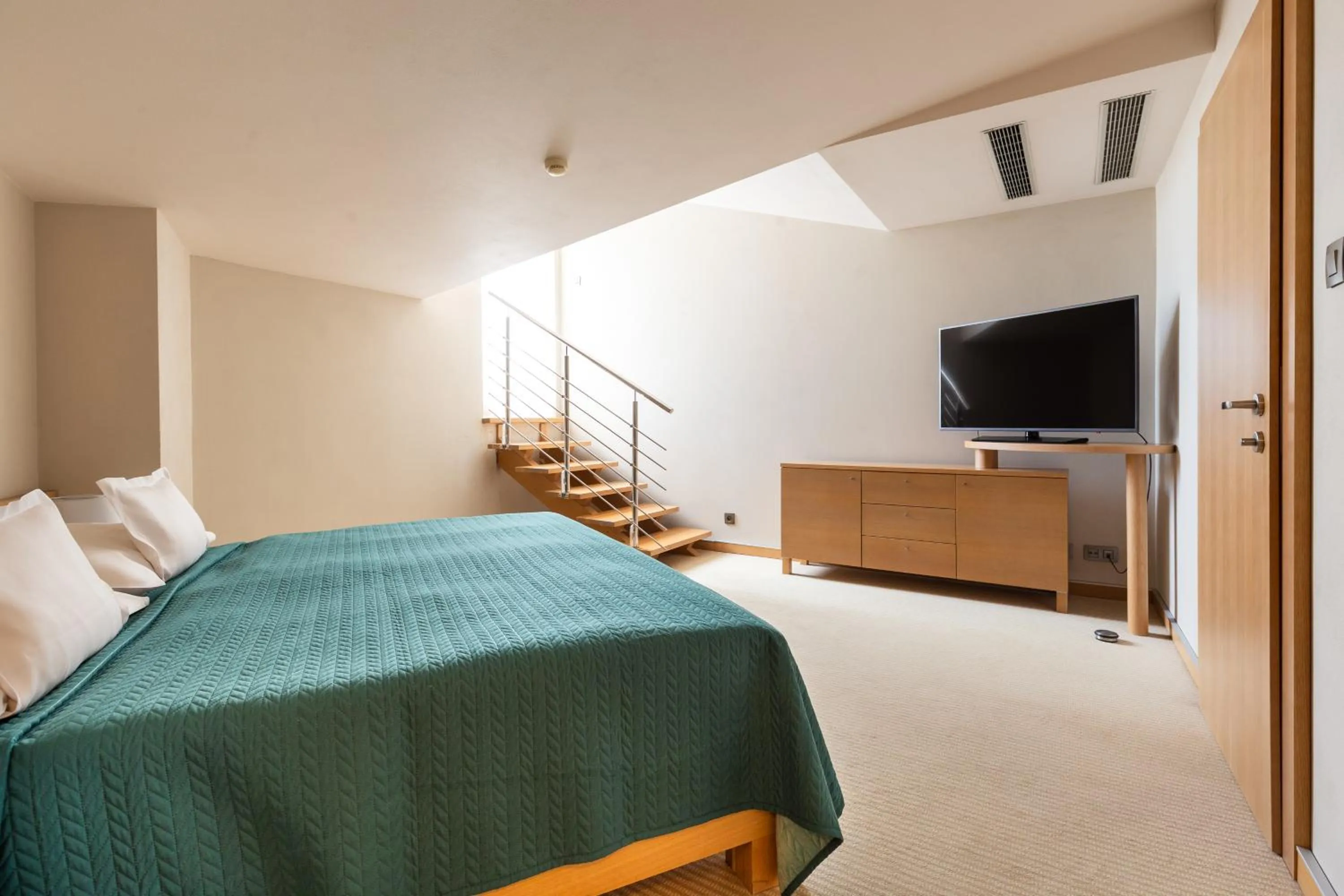 Bed in Roset Hotel & Residence