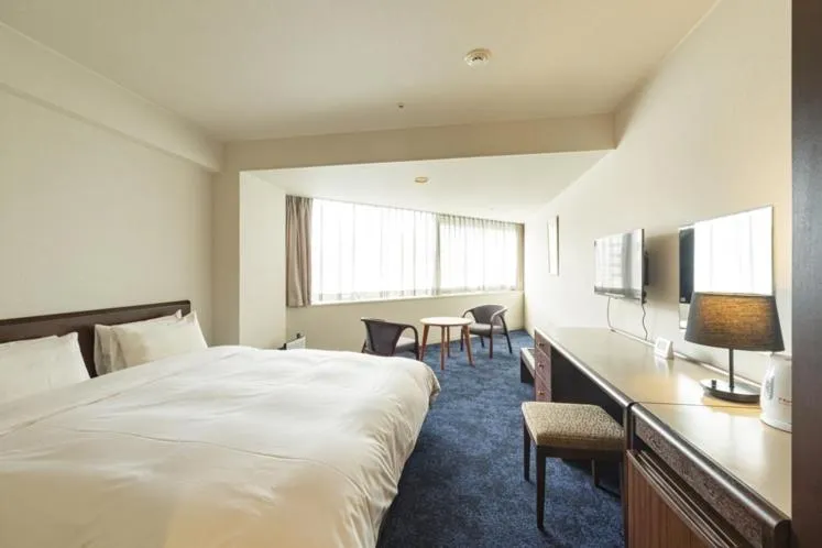 Bed in Awa Kanko Hotel