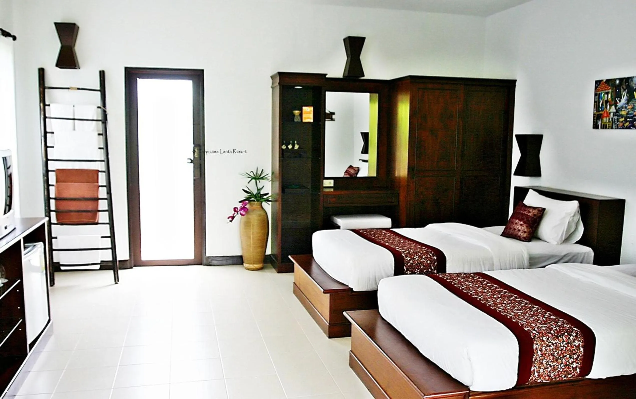 Bed in Tropicana Lanta Resort