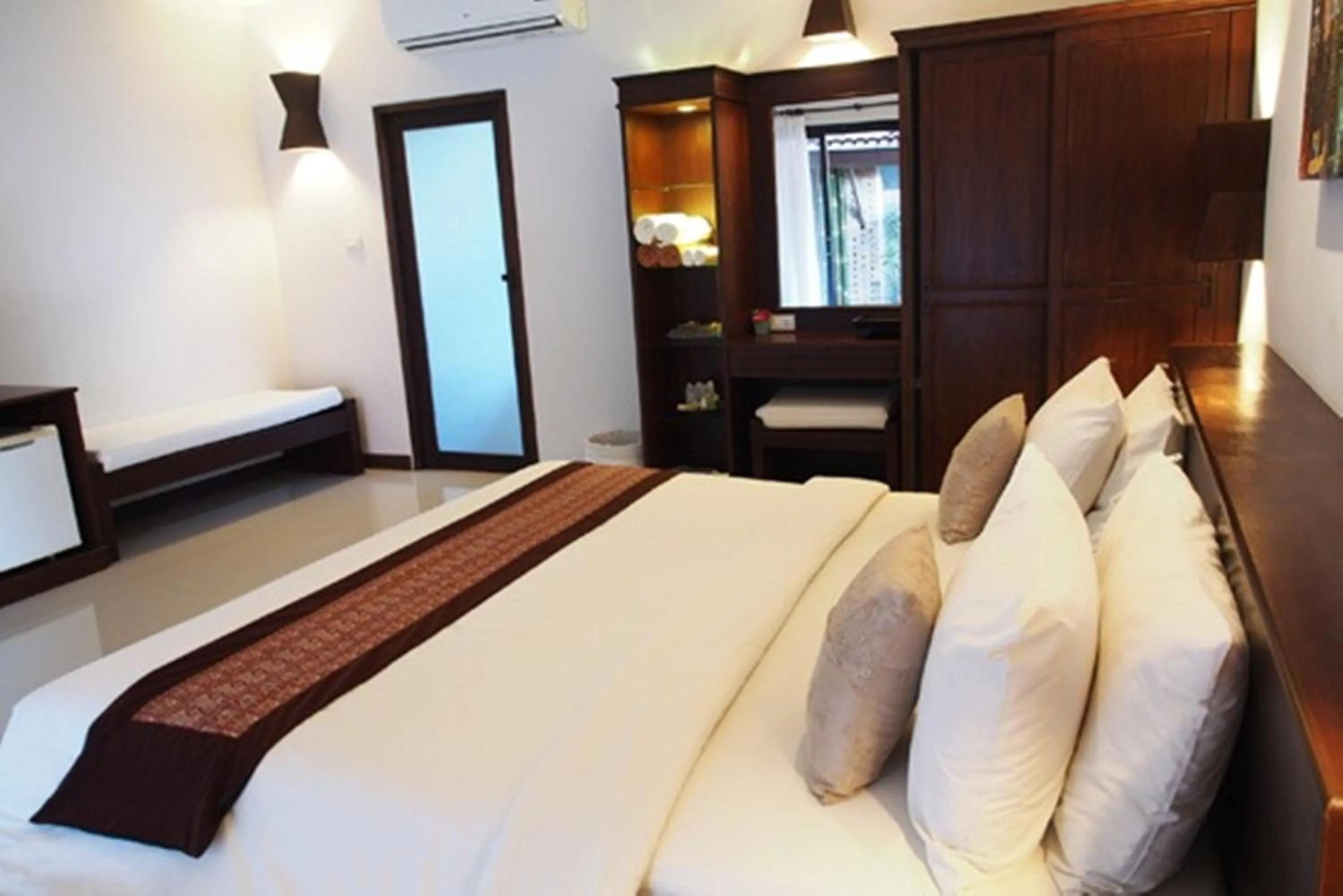 Bed in Tropicana Lanta Resort