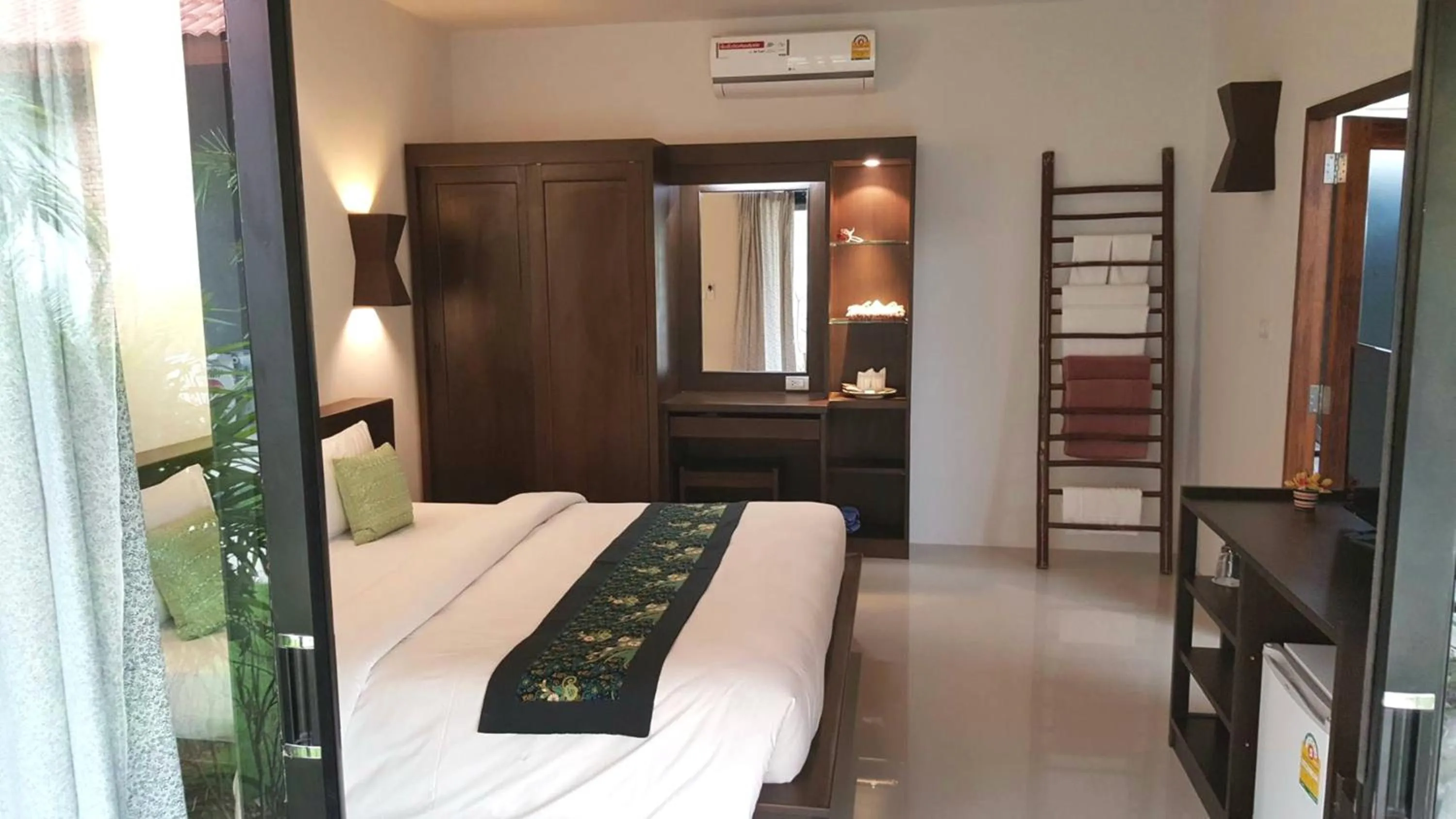 Bed in Tropicana Lanta Resort