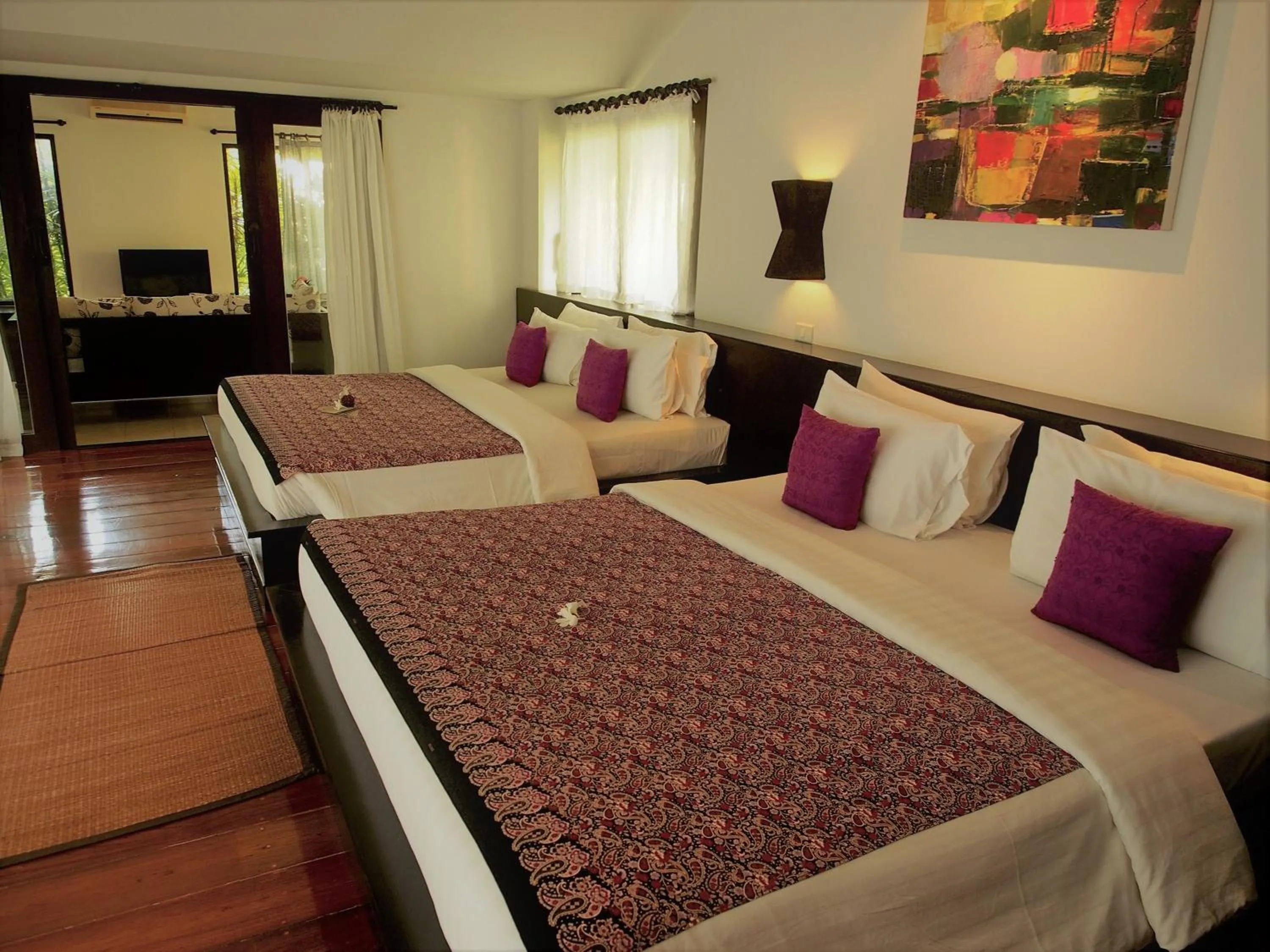 Bed in Tropicana Lanta Resort