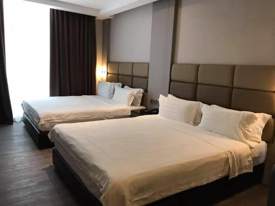 Bed in KK Times Square Hotel