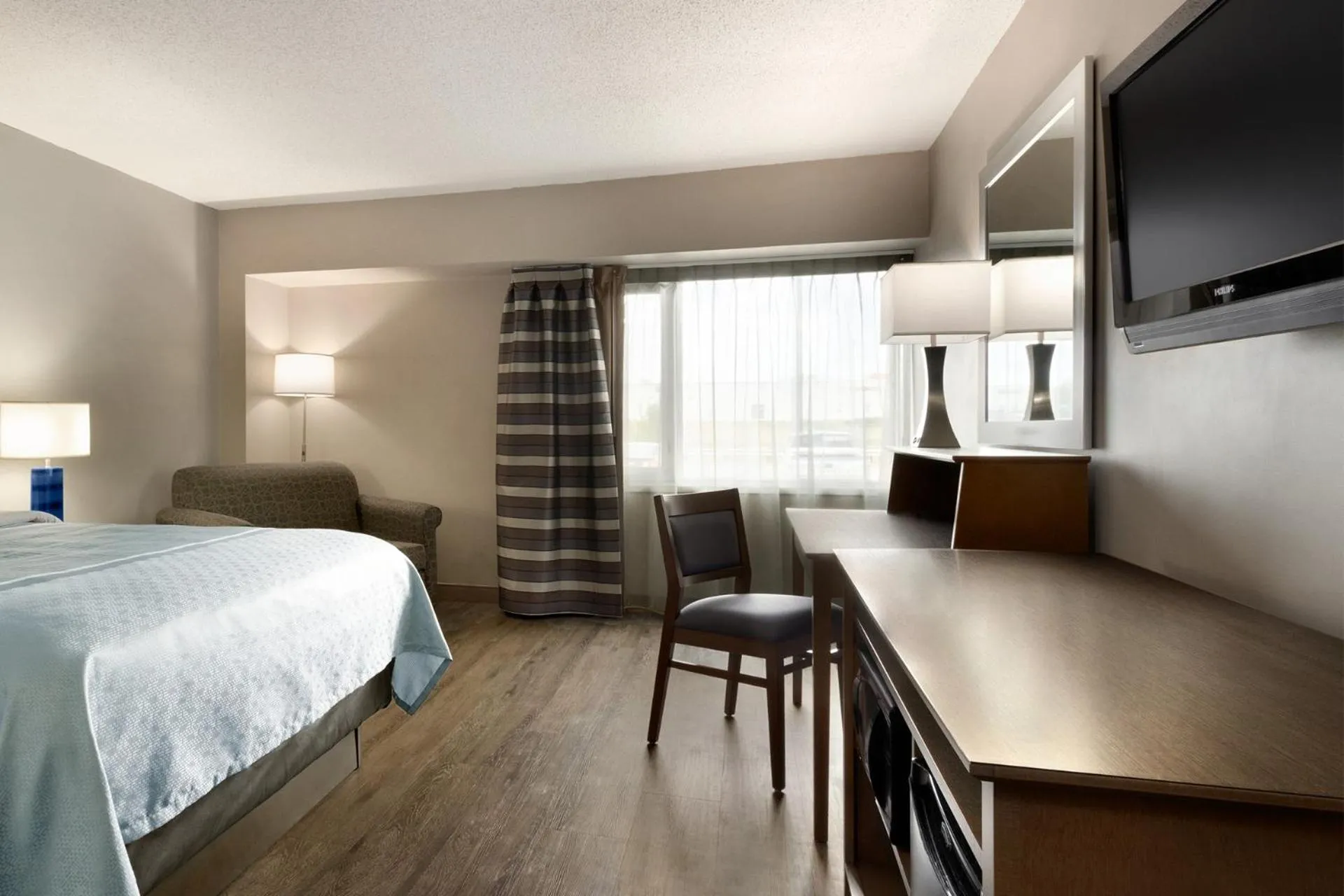 Bed in Travelodge Hotel by Wyndham Saskatoon