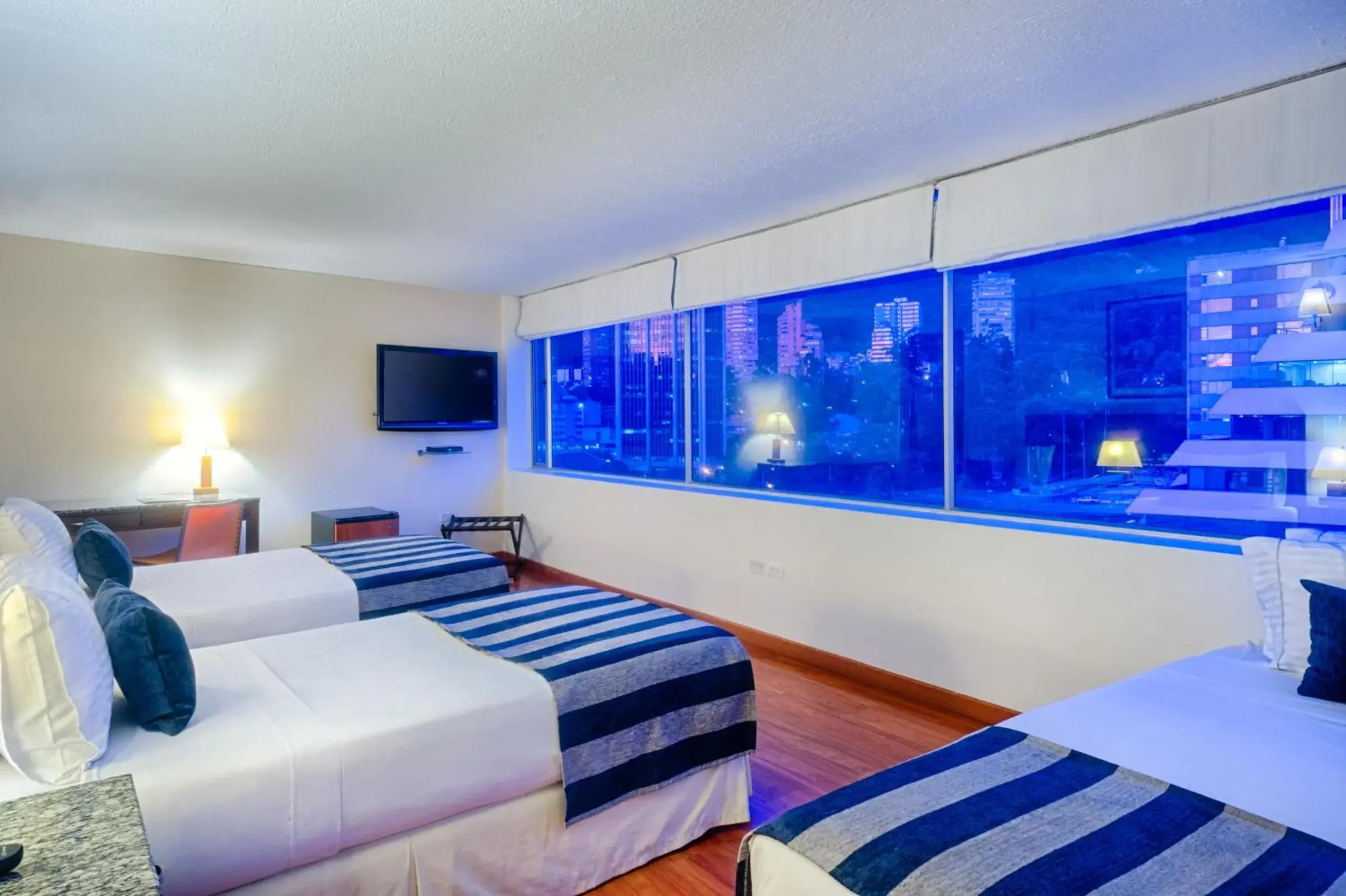 Standard Quadruple Room in Hotel Oceanía Bogotá Museo Standard Quadruple Room in Hotel Oceanía Bogotá Museo