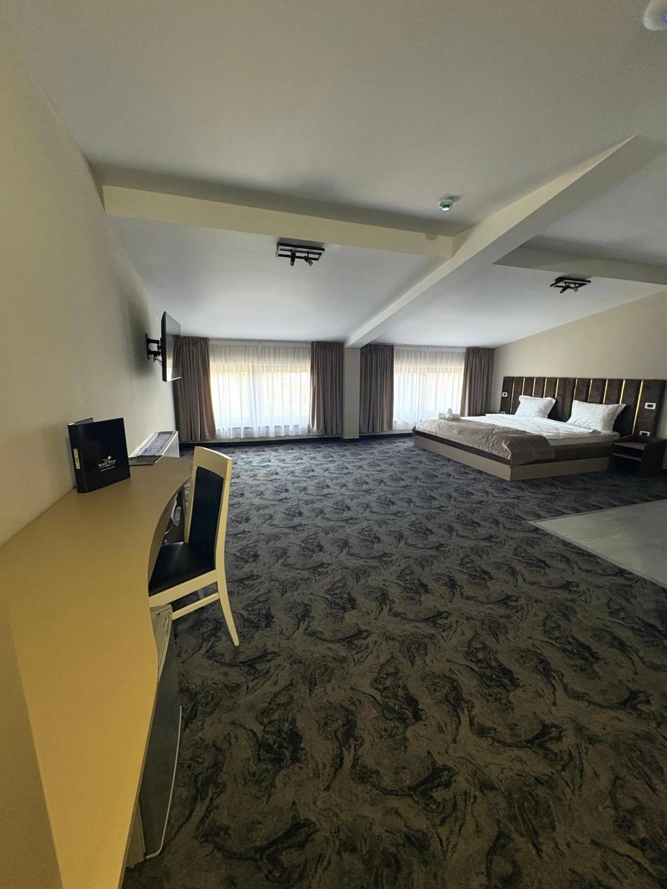 Bed in Black Tulip Hotel