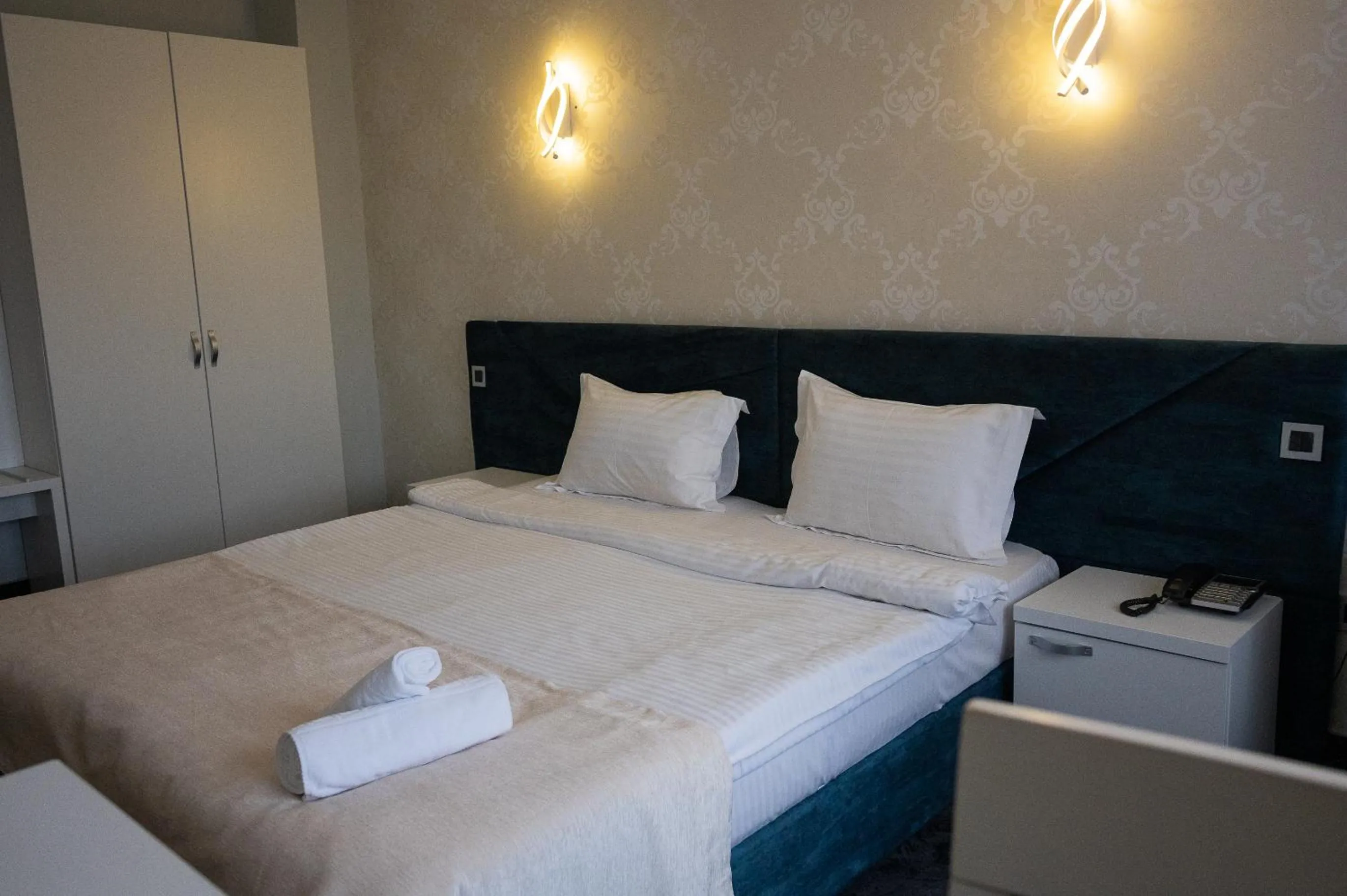 Bed in Black Tulip Hotel