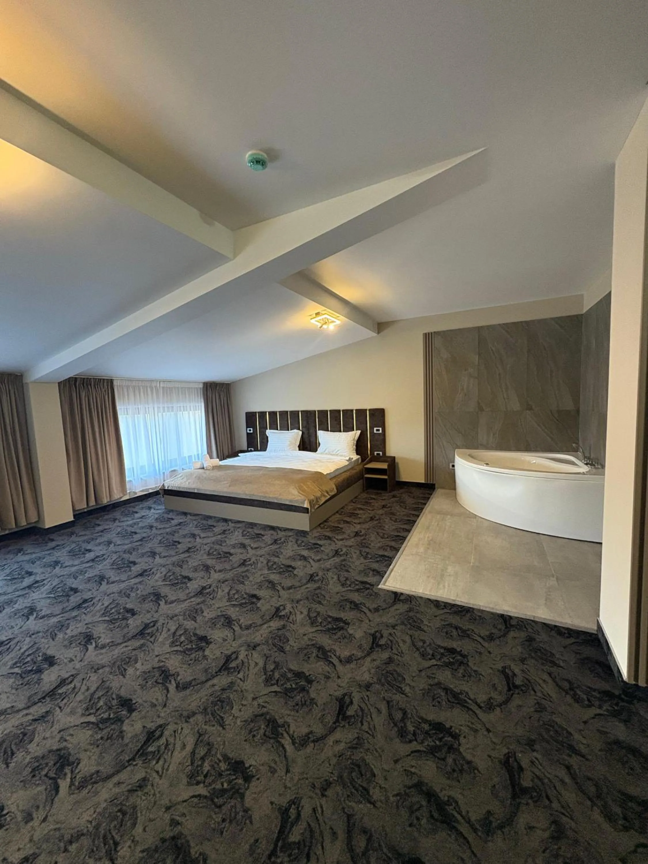 Bed in Black Tulip Hotel