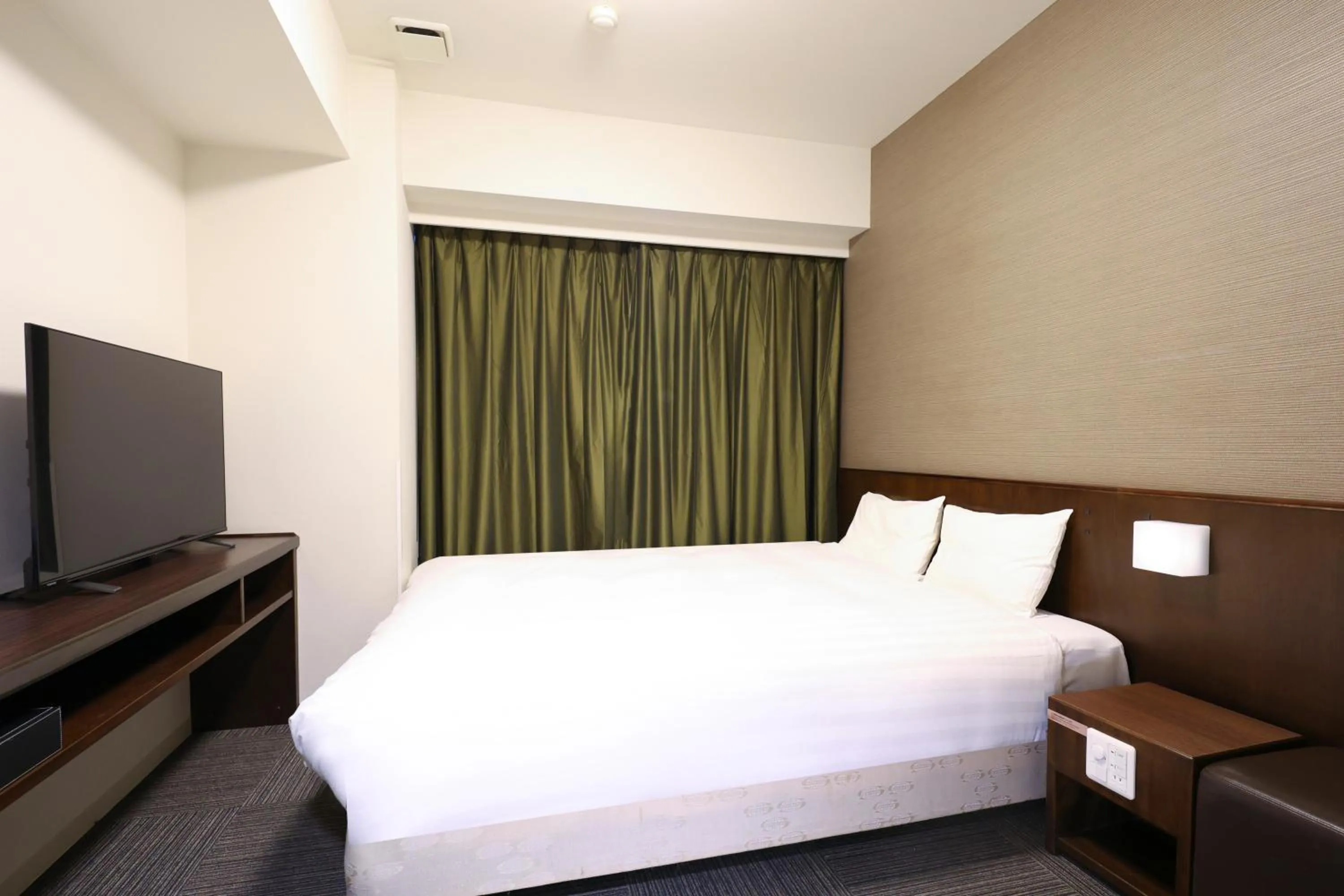 Bed in Dormy Inn Matsumoto