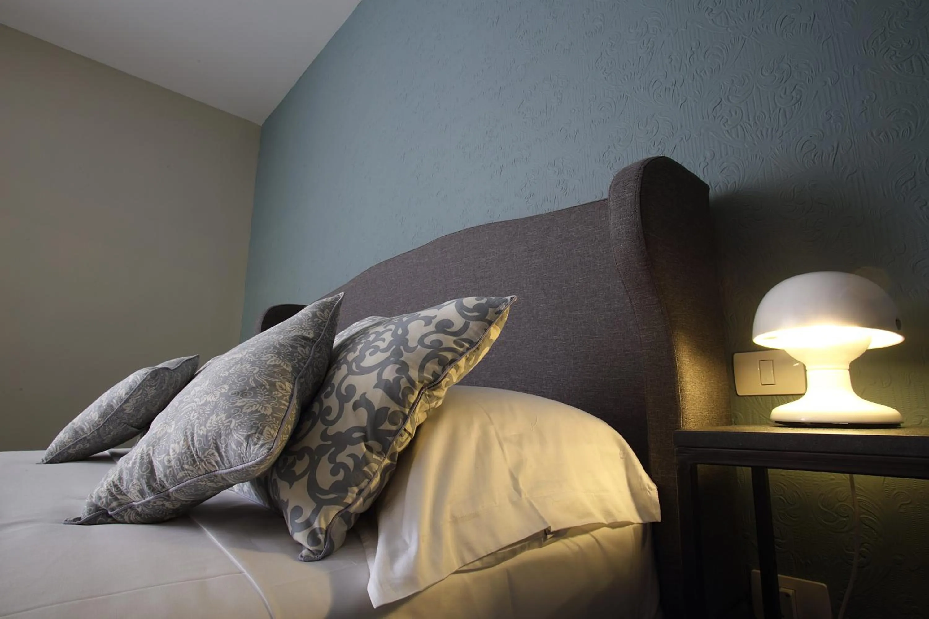 Bed in Avolio Tailored Rooms