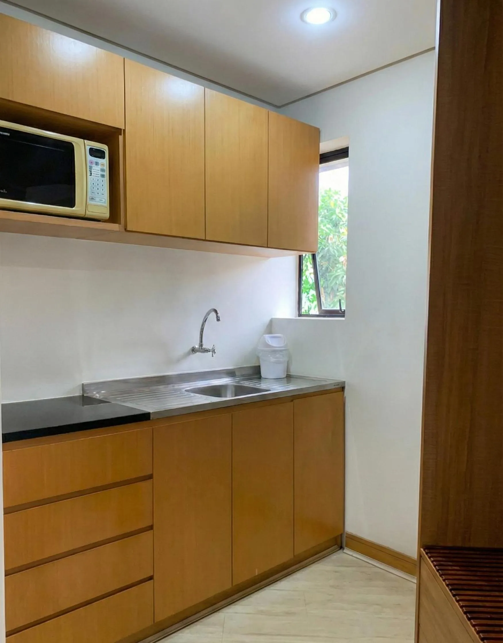 Kitchen or kitchenette in Bienal Suítes