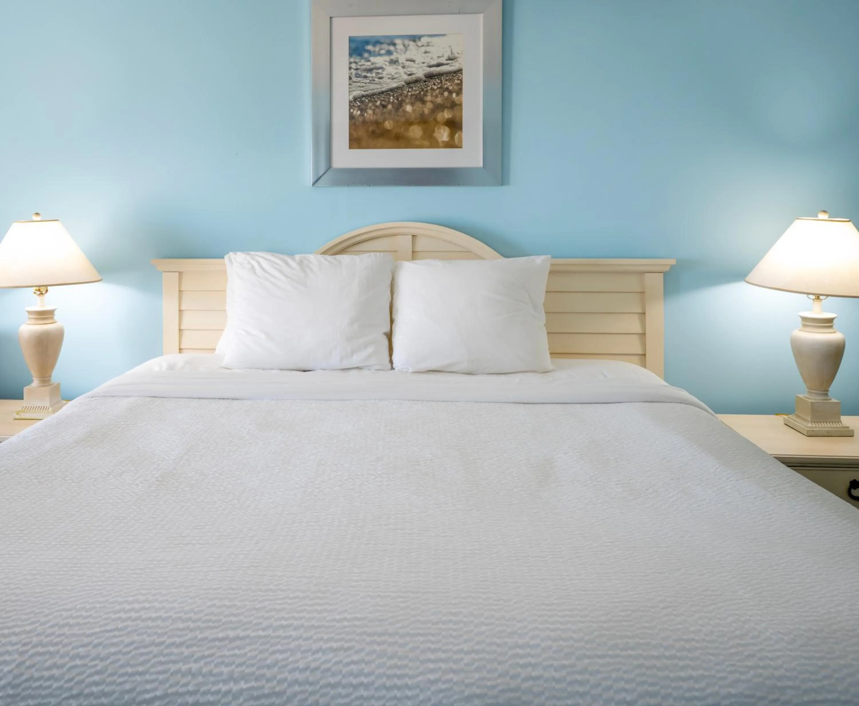 Bed in Drifting Sands Oceanfront Hotel