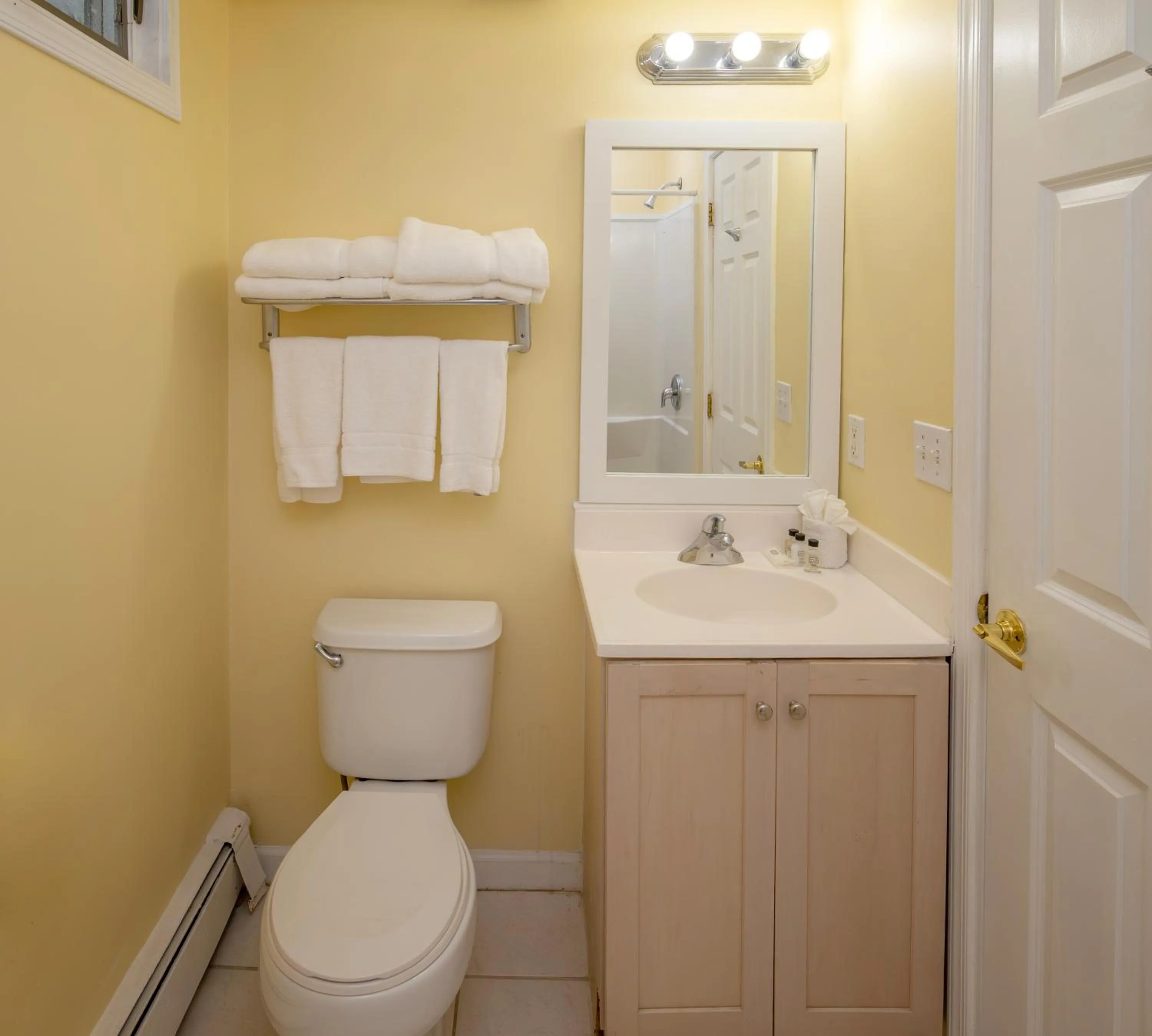 Toilet in Drifting Sands Oceanfront Hotel