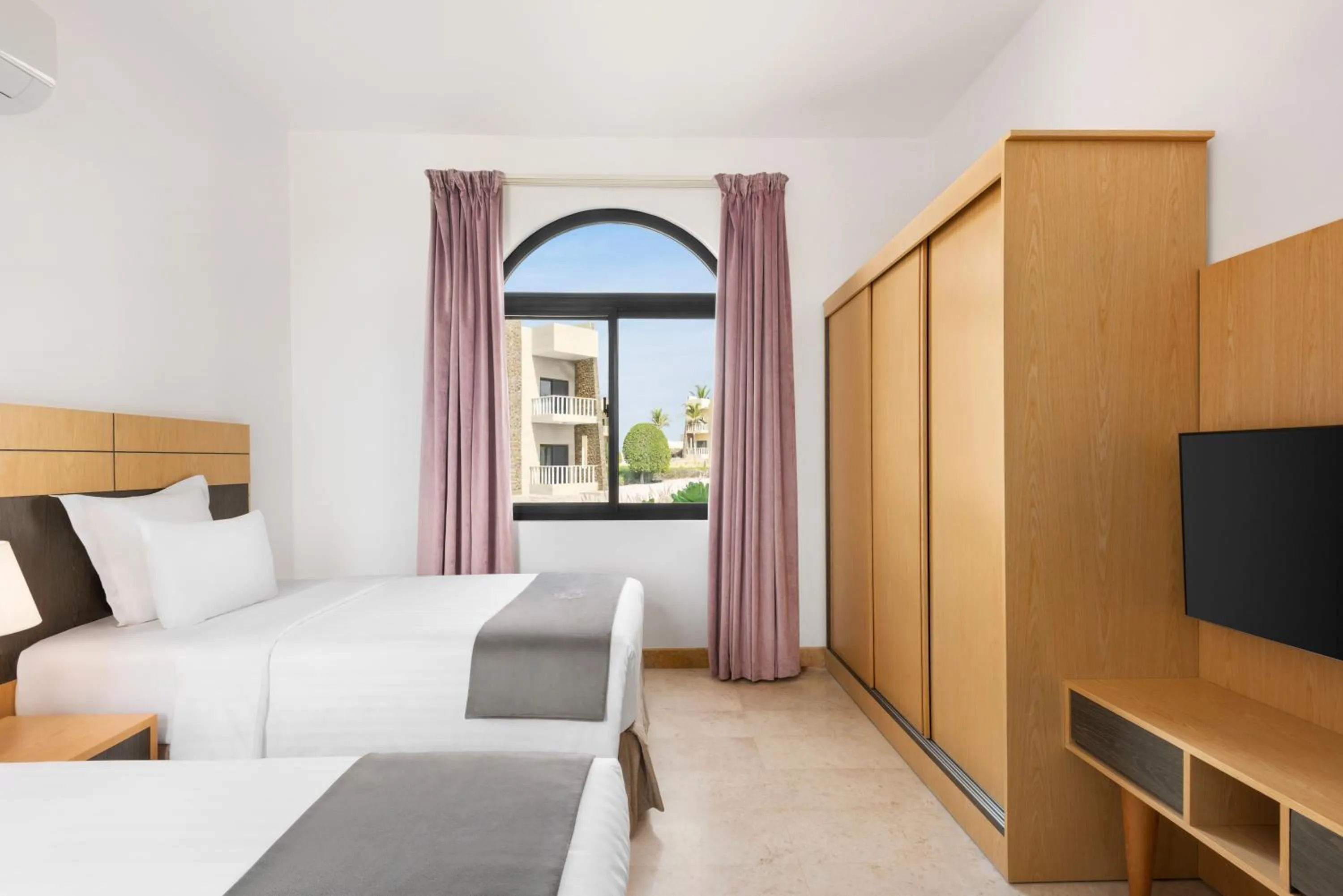 Photo of the whole room, Bed in Wyndham Garden Salalah Mirbat