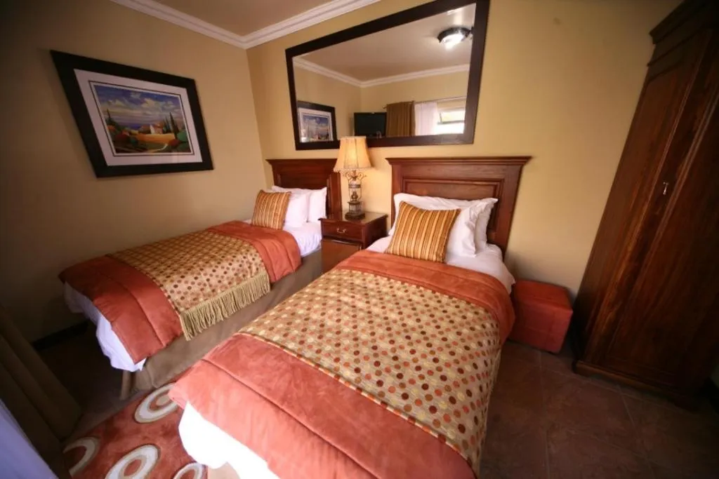 Photo of the whole room in Le Cozmo Guesthouse