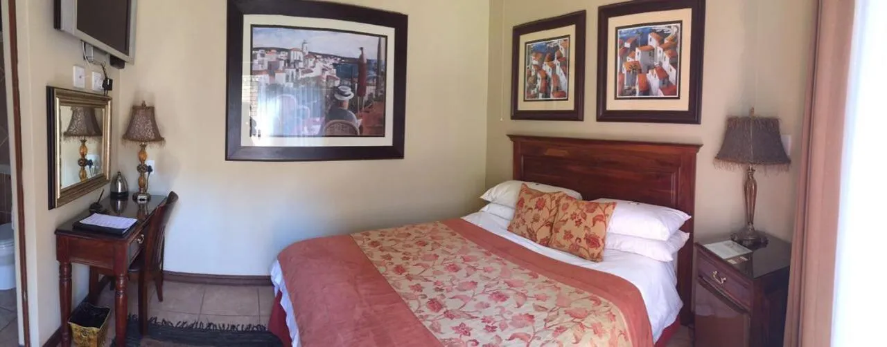 Bed in Le Cozmo Guesthouse