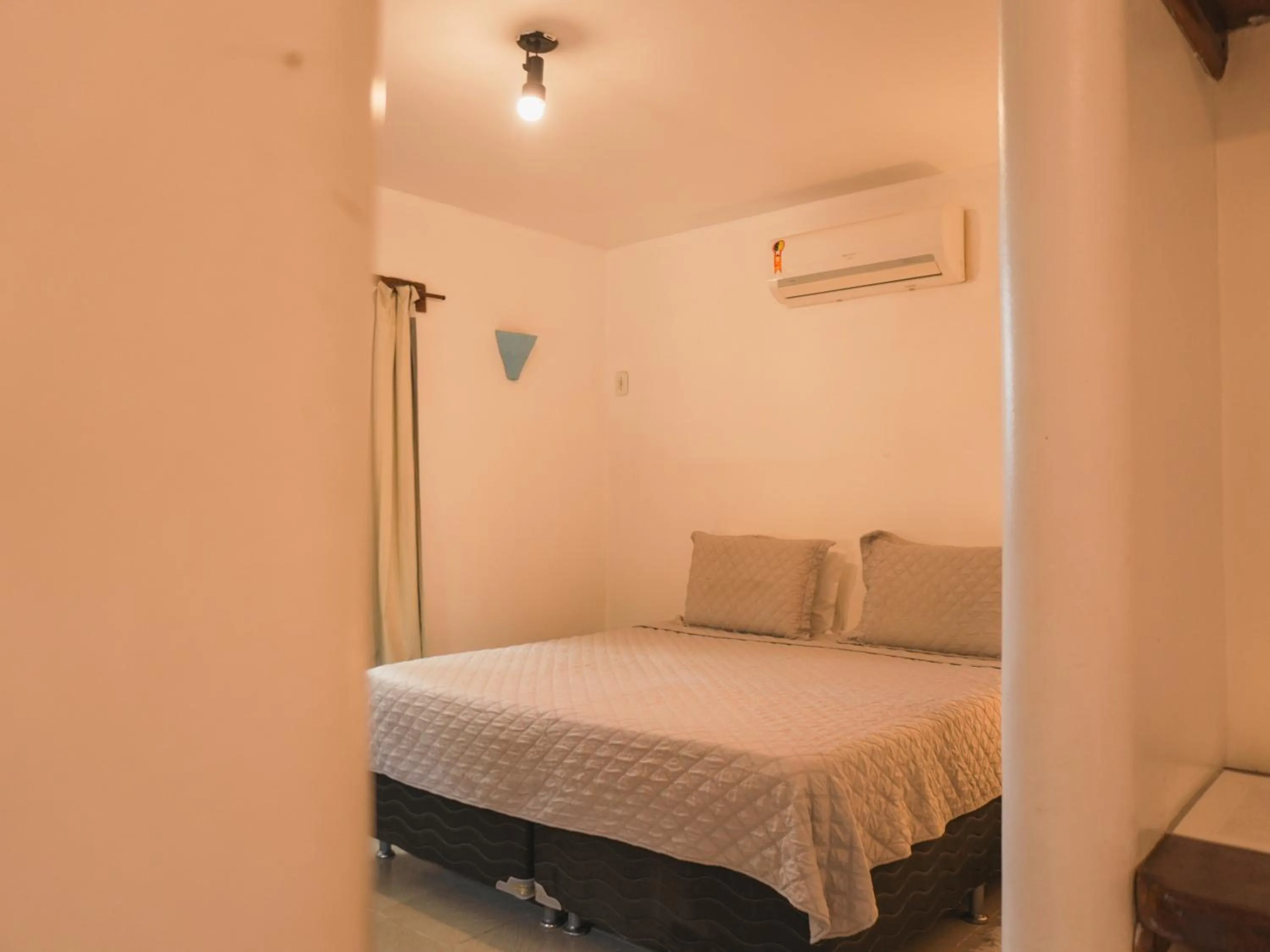 Bed in Pousada Erva Doce