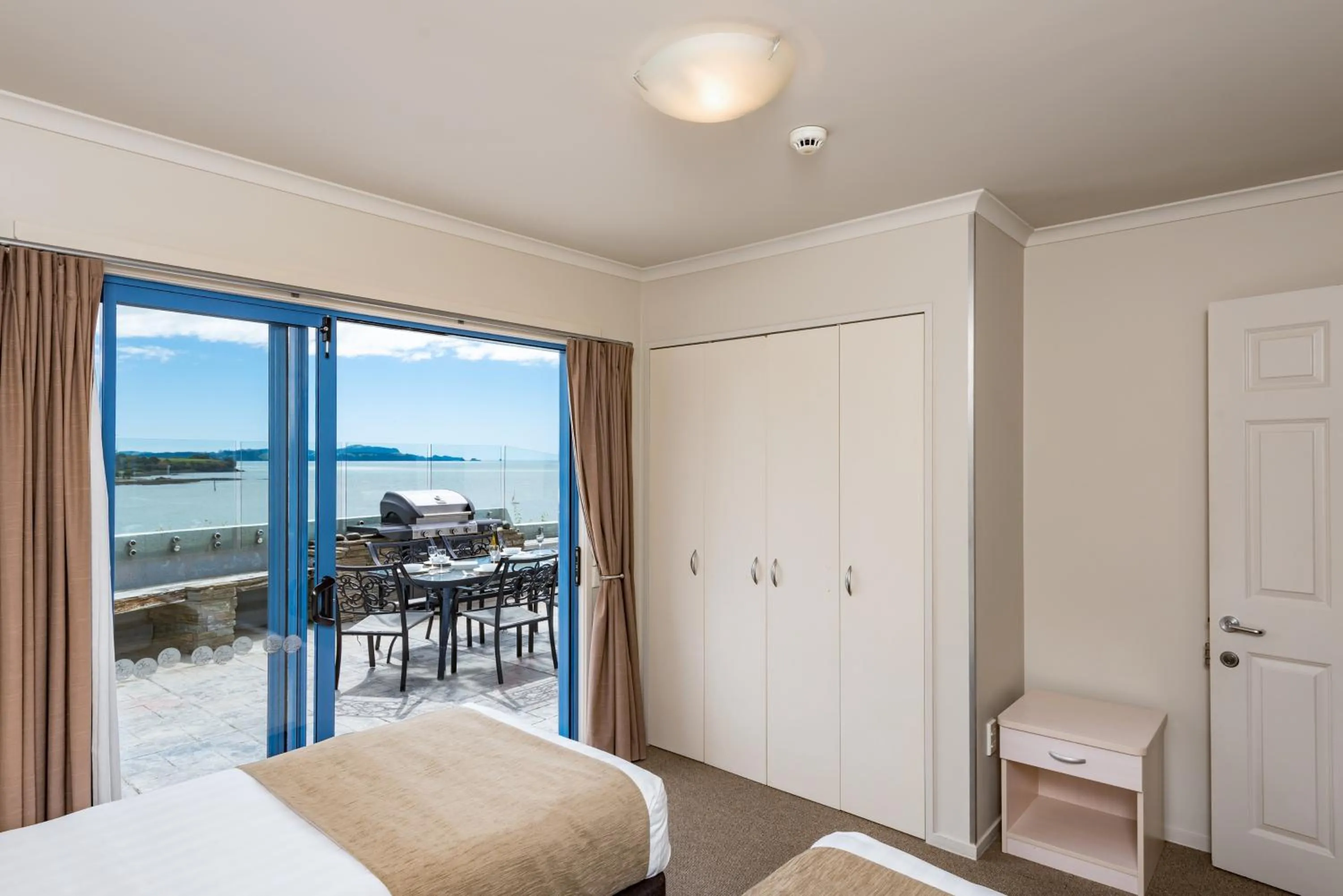 Bed in Blue Pacific Apartments