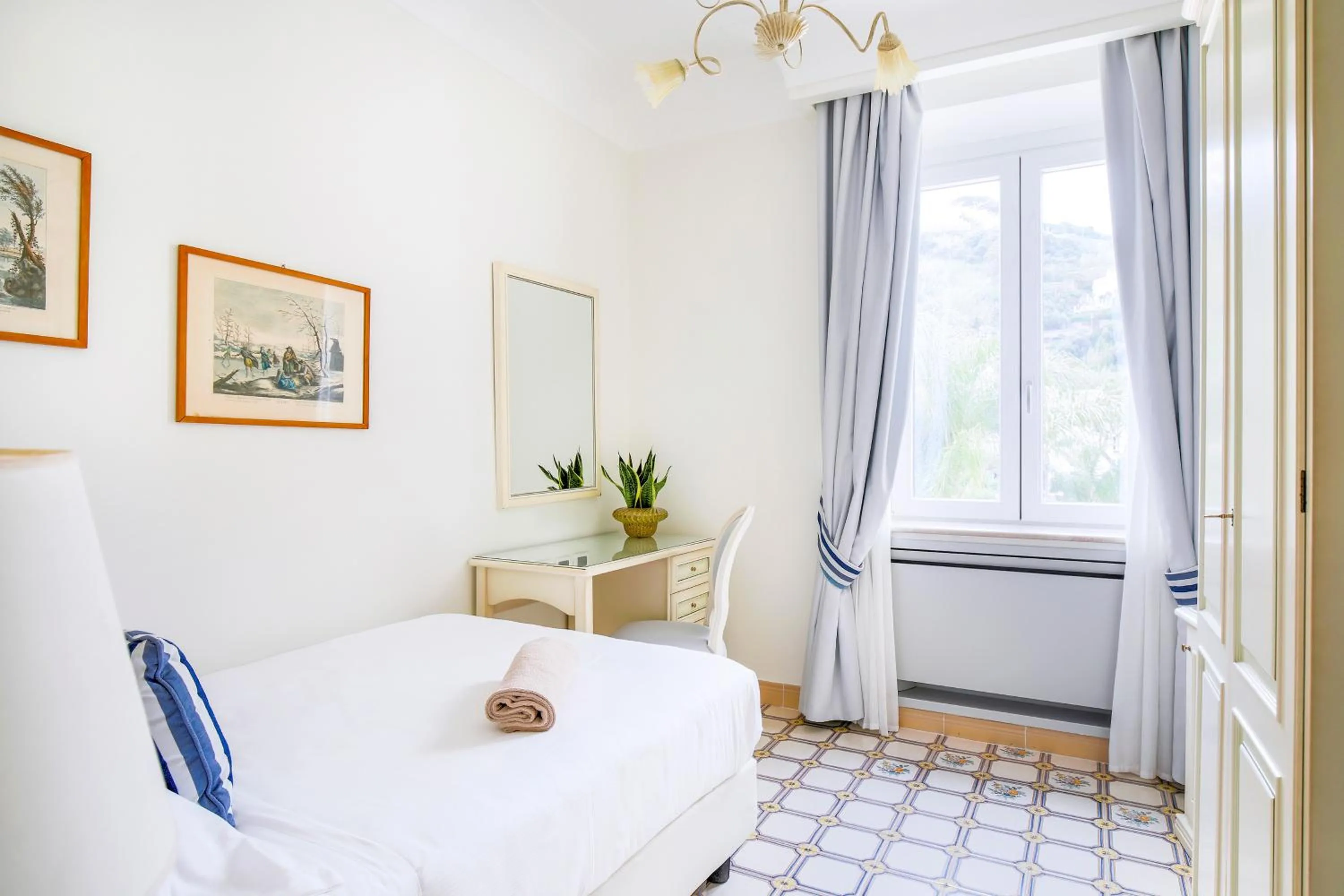 Bed in La Reginella Resort & Spa