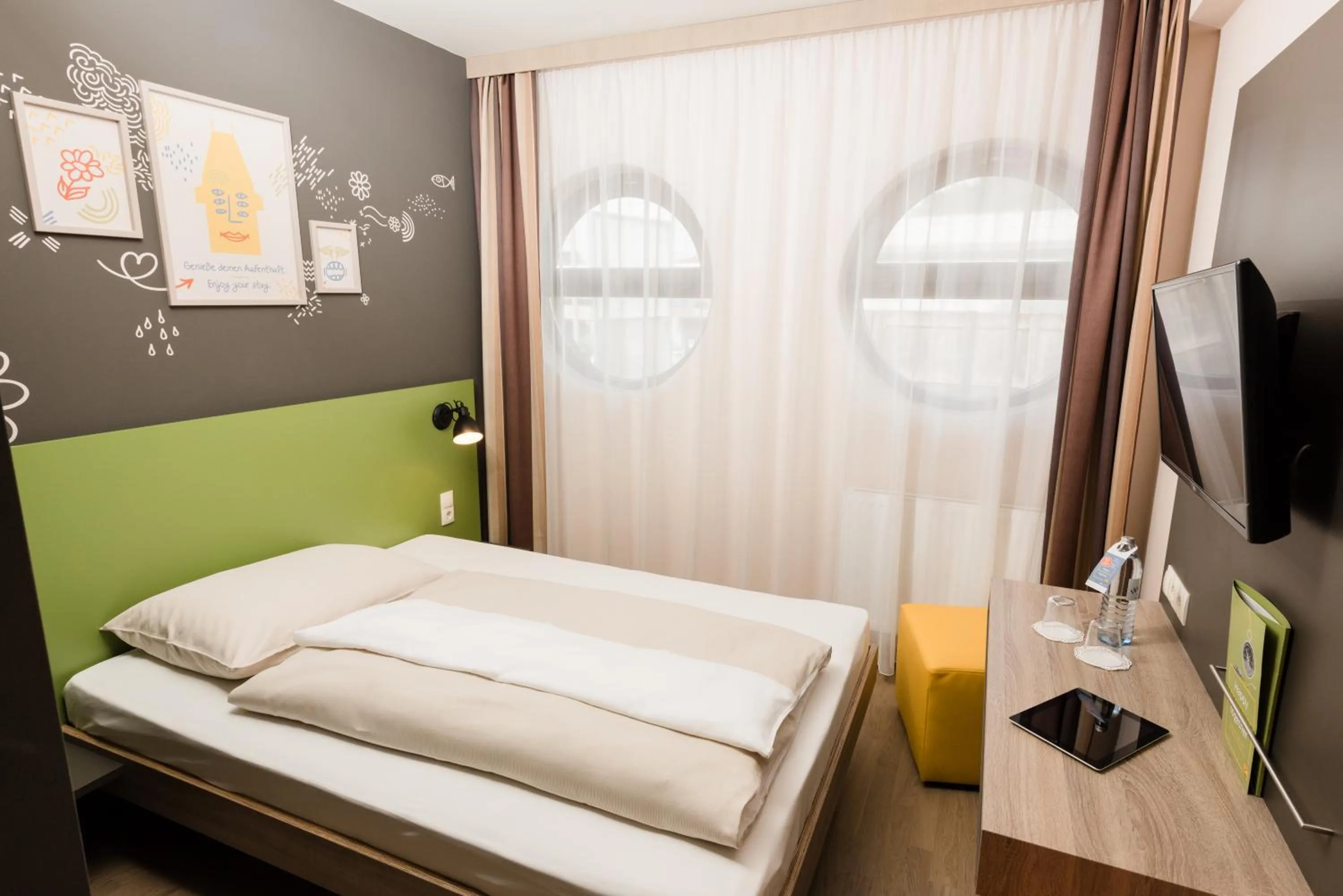 Photo of the whole room, Bed in JUFA Hotel Graz Süd - Self Check-in