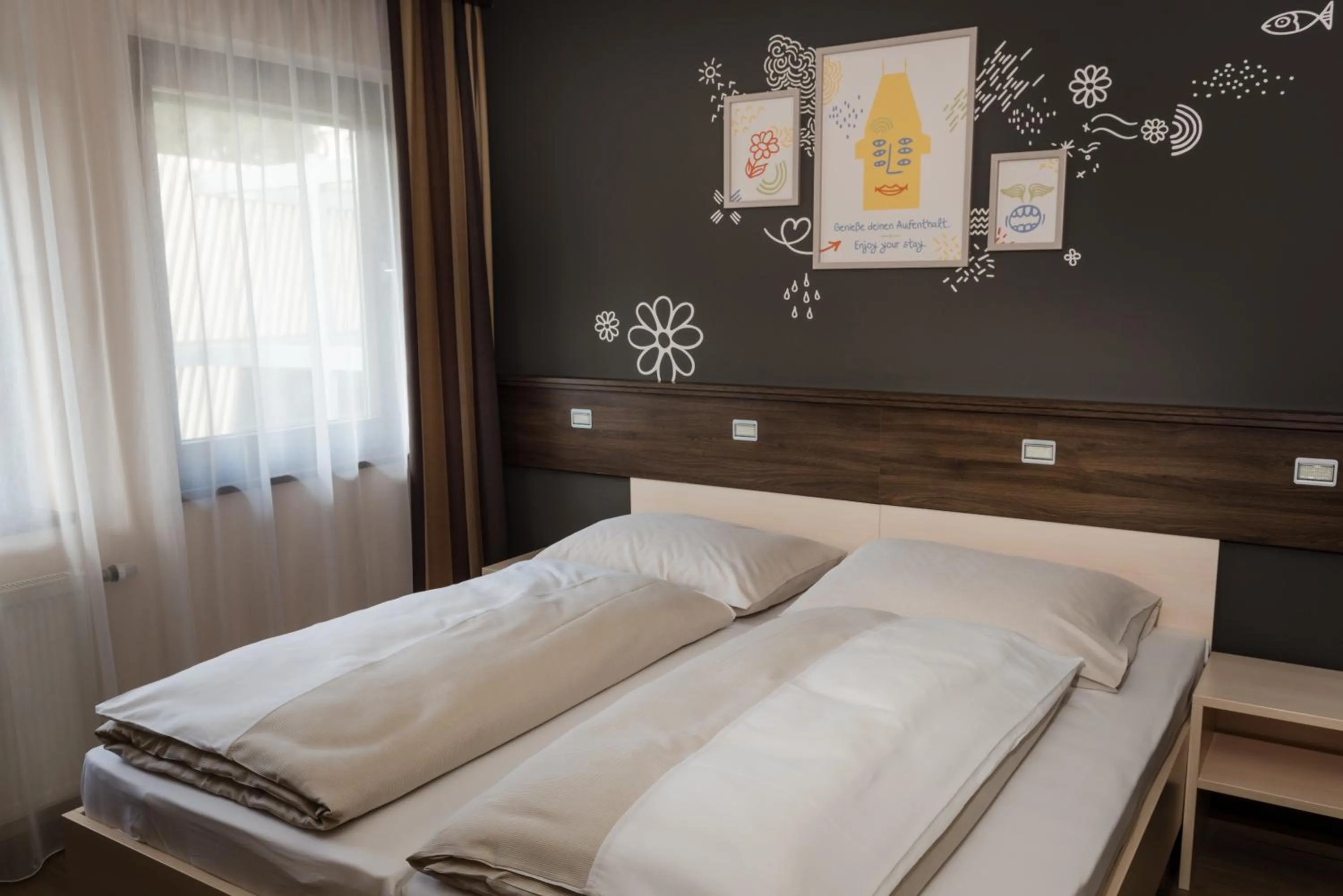 Photo of the whole room, Bed in JUFA Hotel Graz Süd - Self Check-in