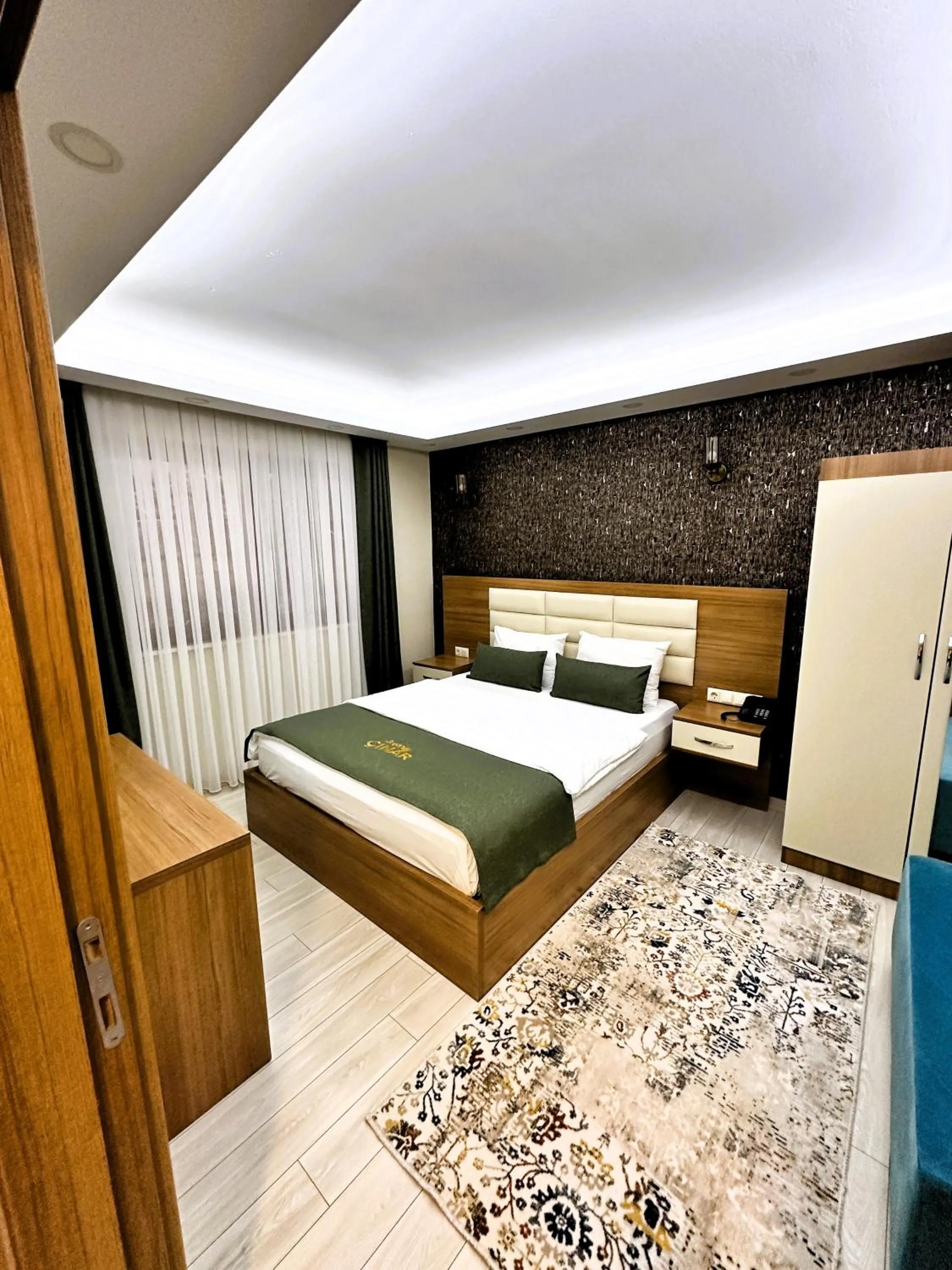 Bed in Green Cinar Apart