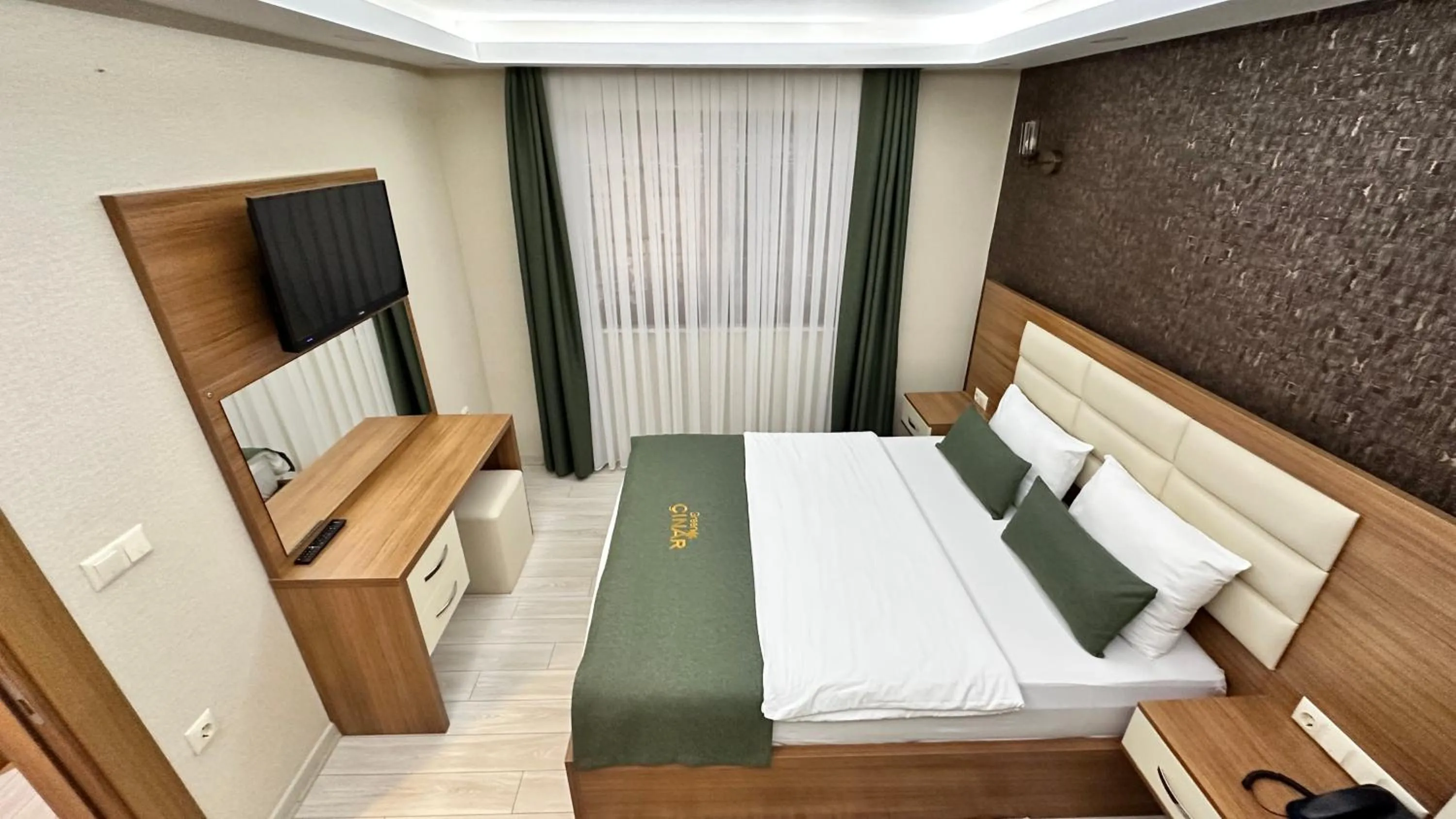 Bed in Green Cinar Apart