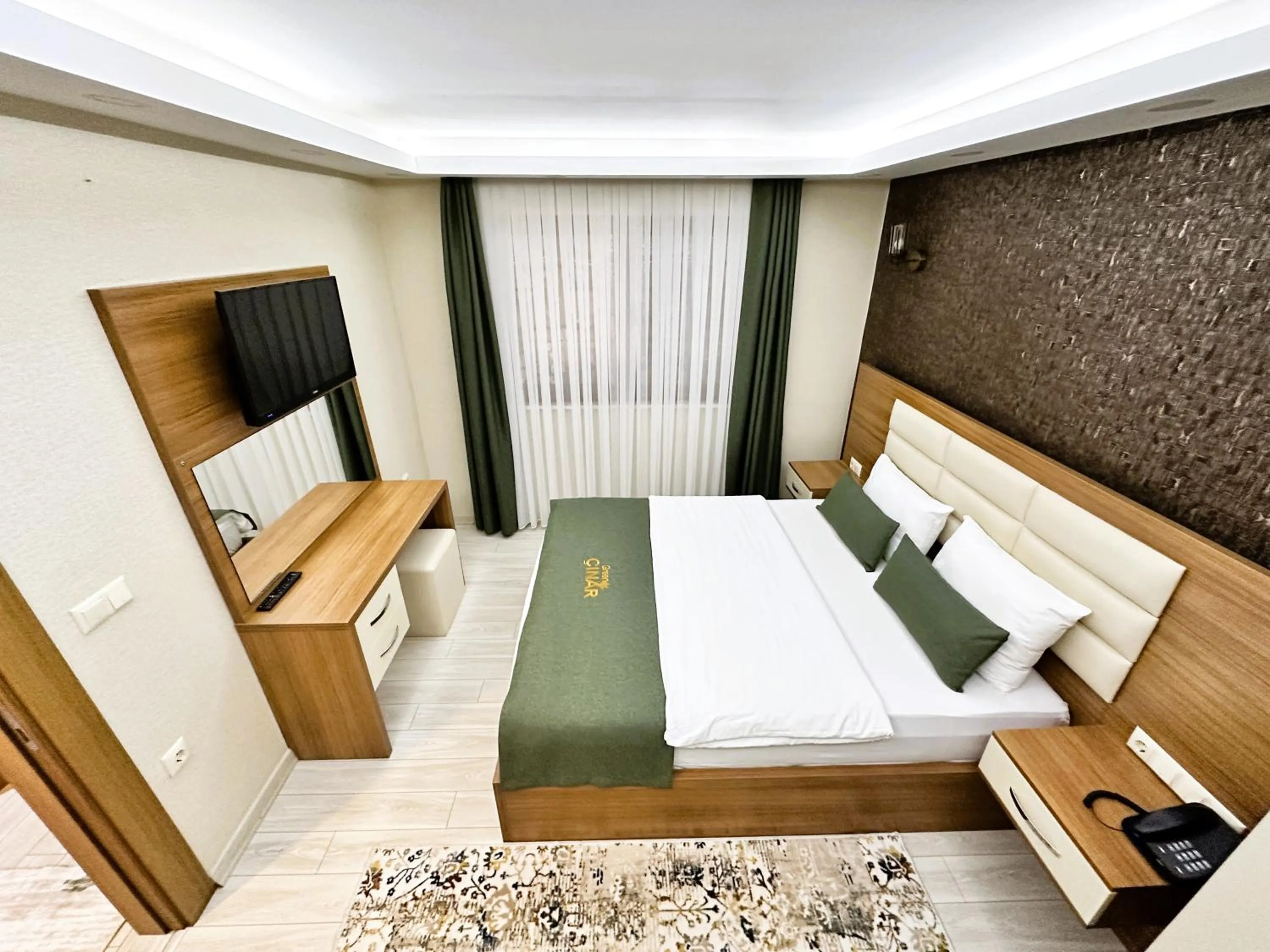 Bed in Green Cinar Apart