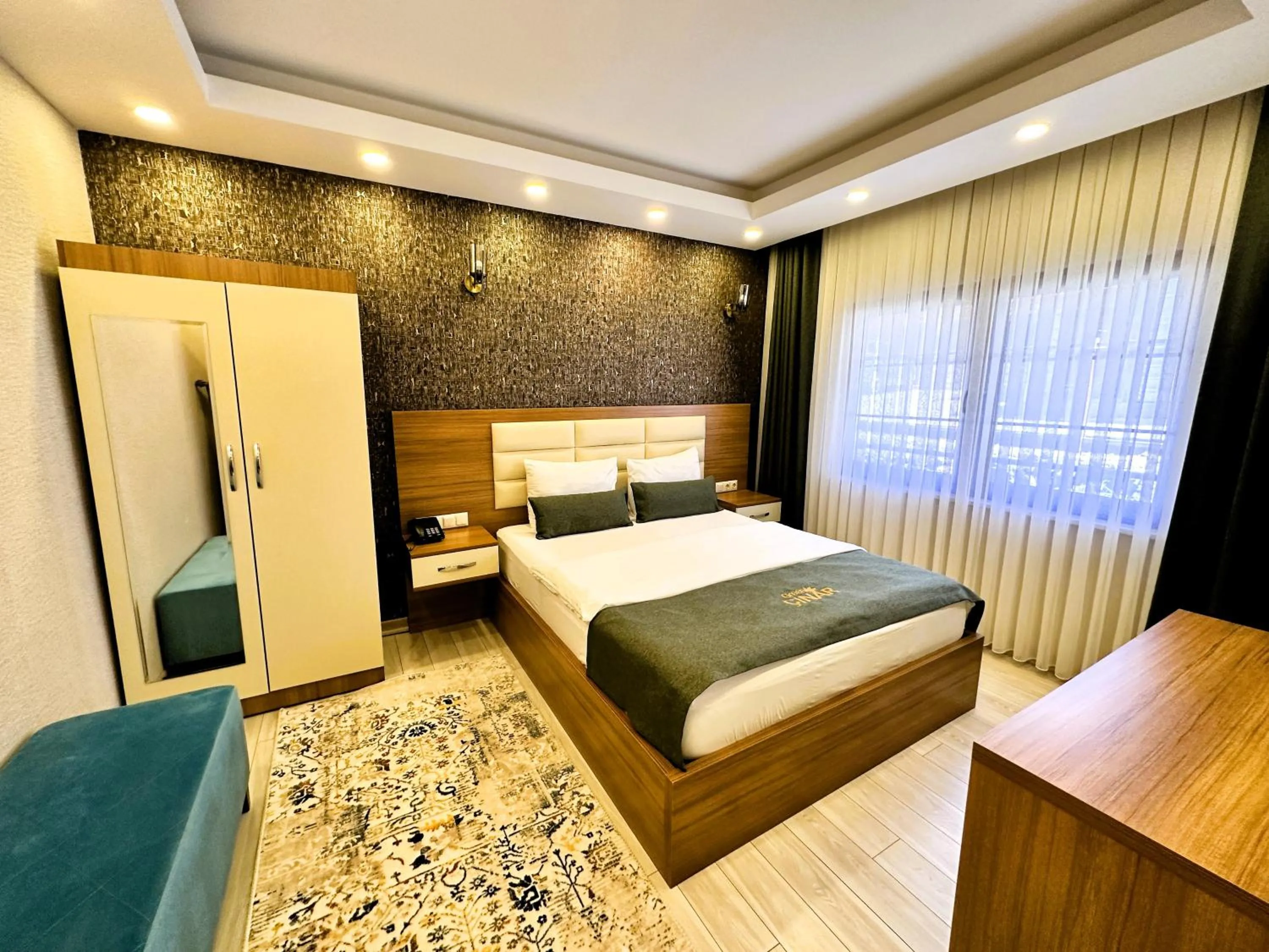 Bed in Green Cinar Apart