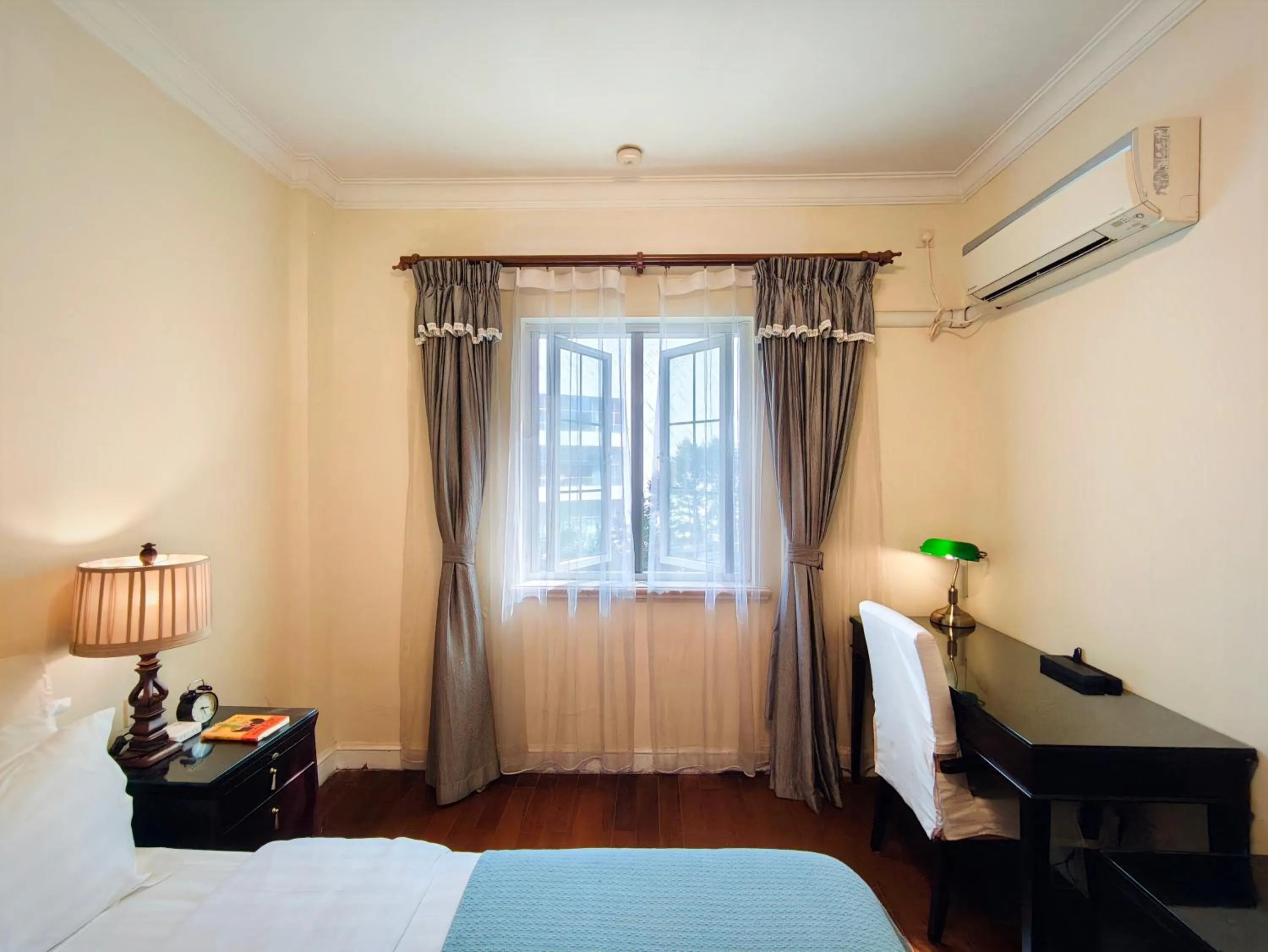 Bed in Ladoll Service Apartments