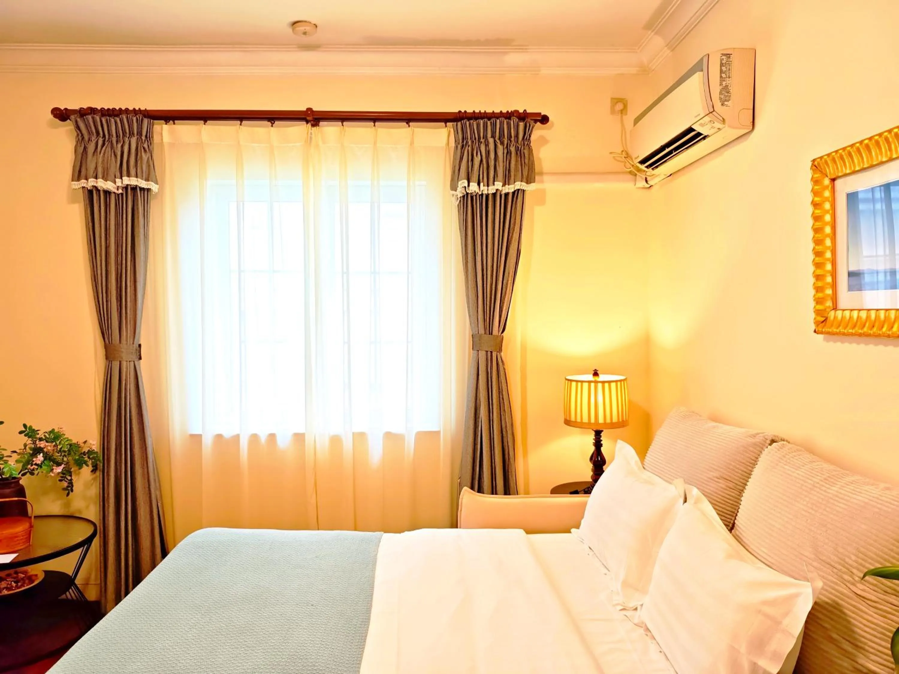 Bed in Ladoll Service Apartments