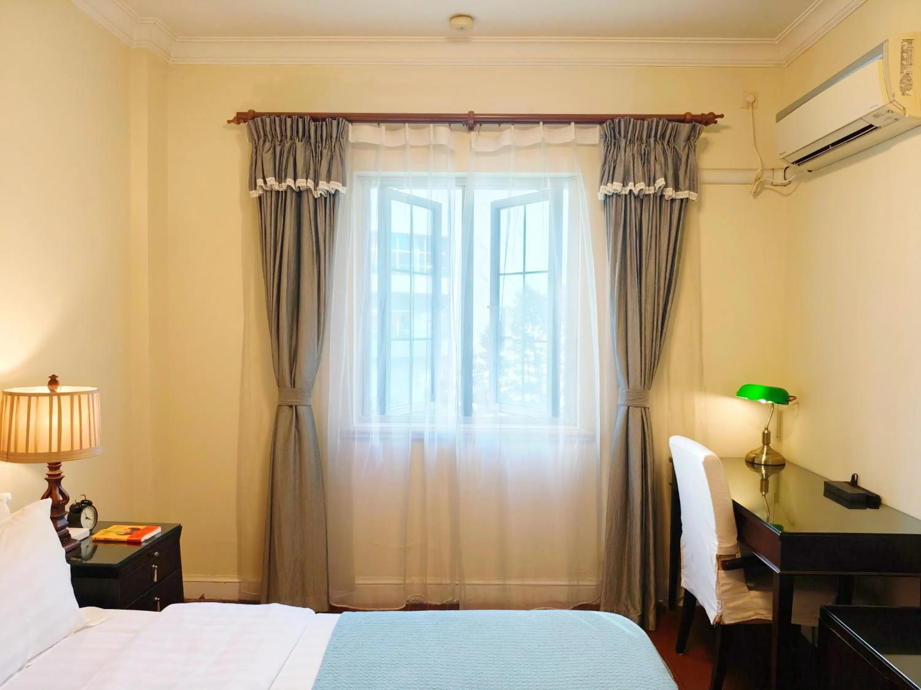 Bed in Ladoll Service Apartments