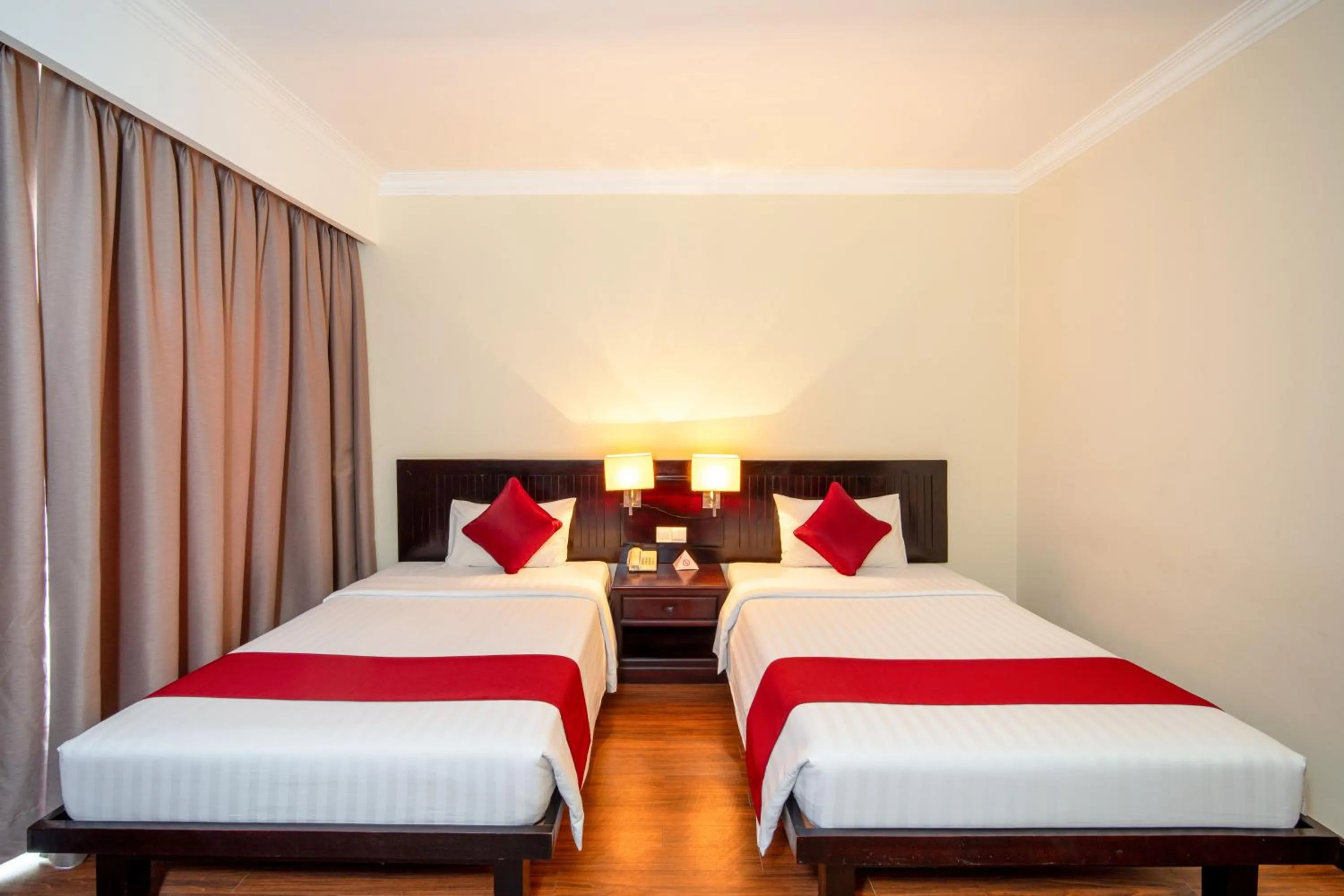 Bed in Khemara Angkor Hotel & Spa