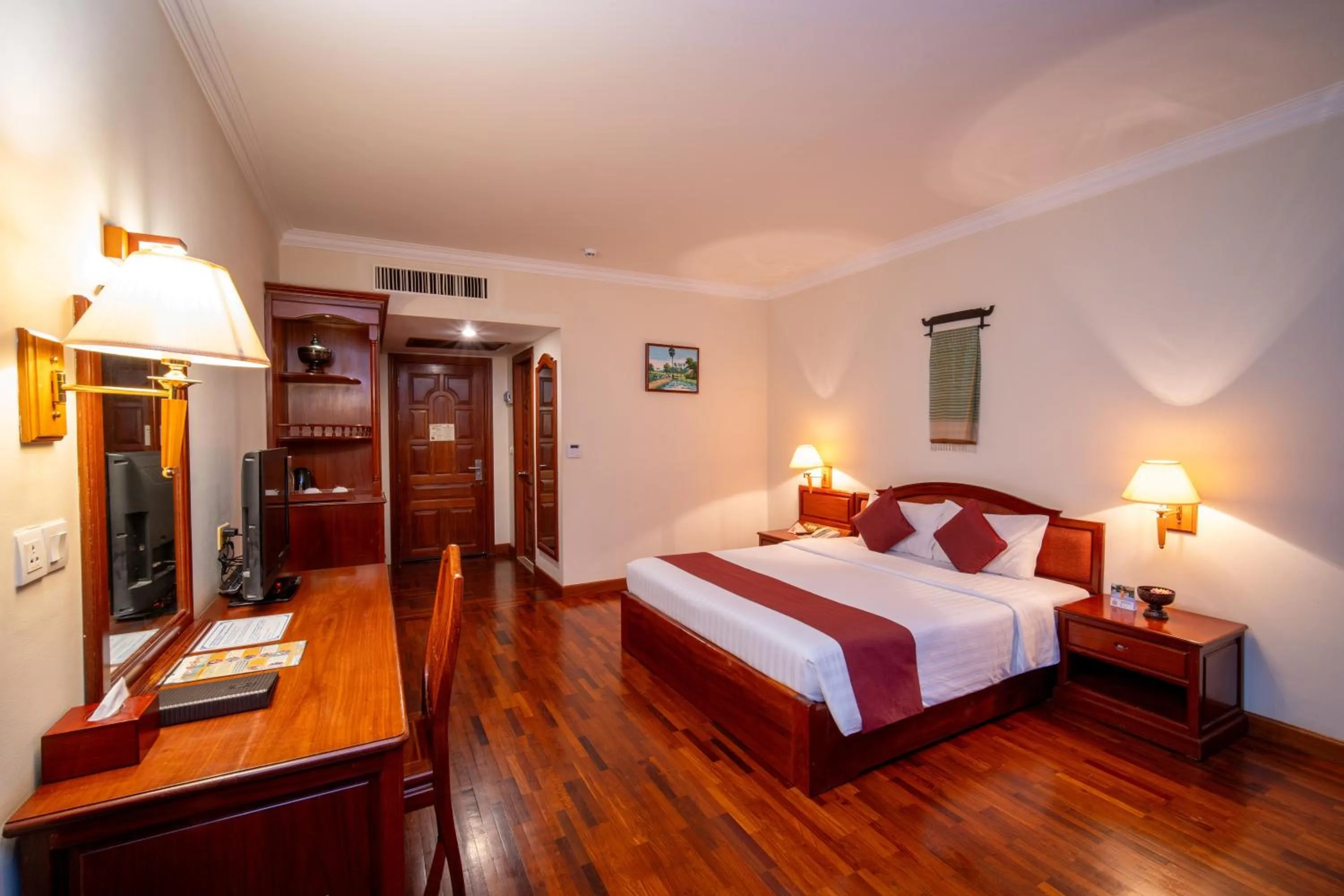 Bed in Khemara Angkor Hotel & Spa