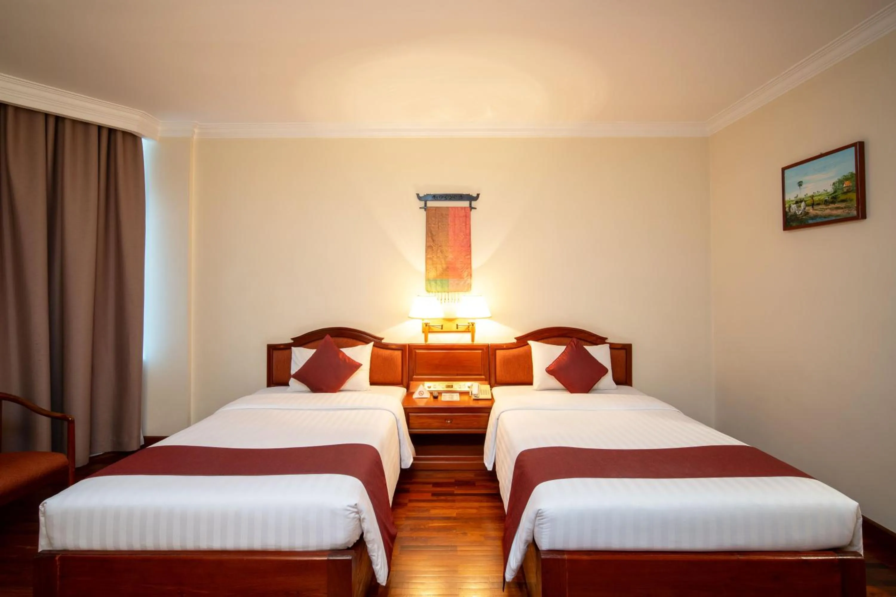 Bed in Khemara Angkor Hotel & Spa