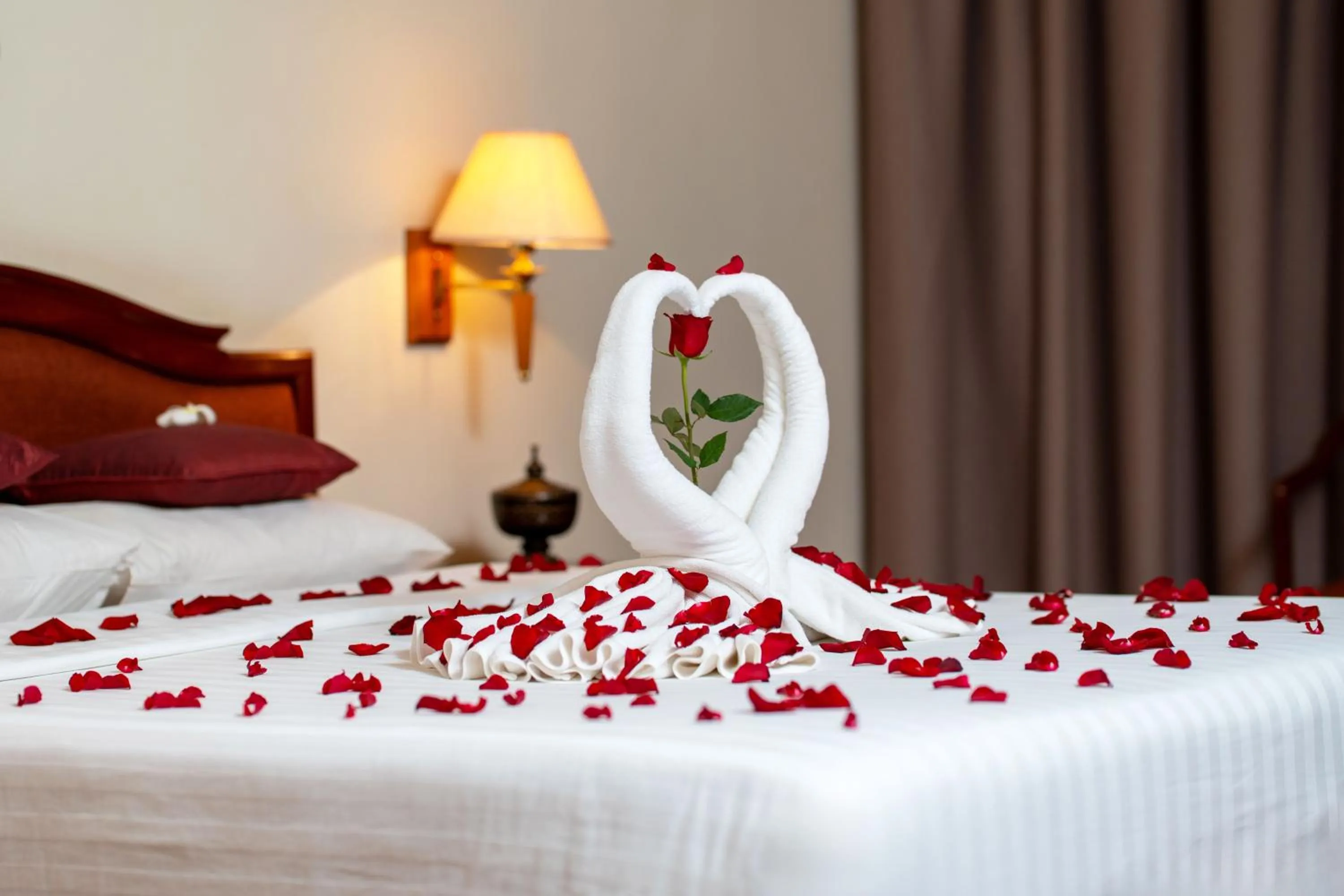 Bed in Khemara Angkor Hotel & Spa