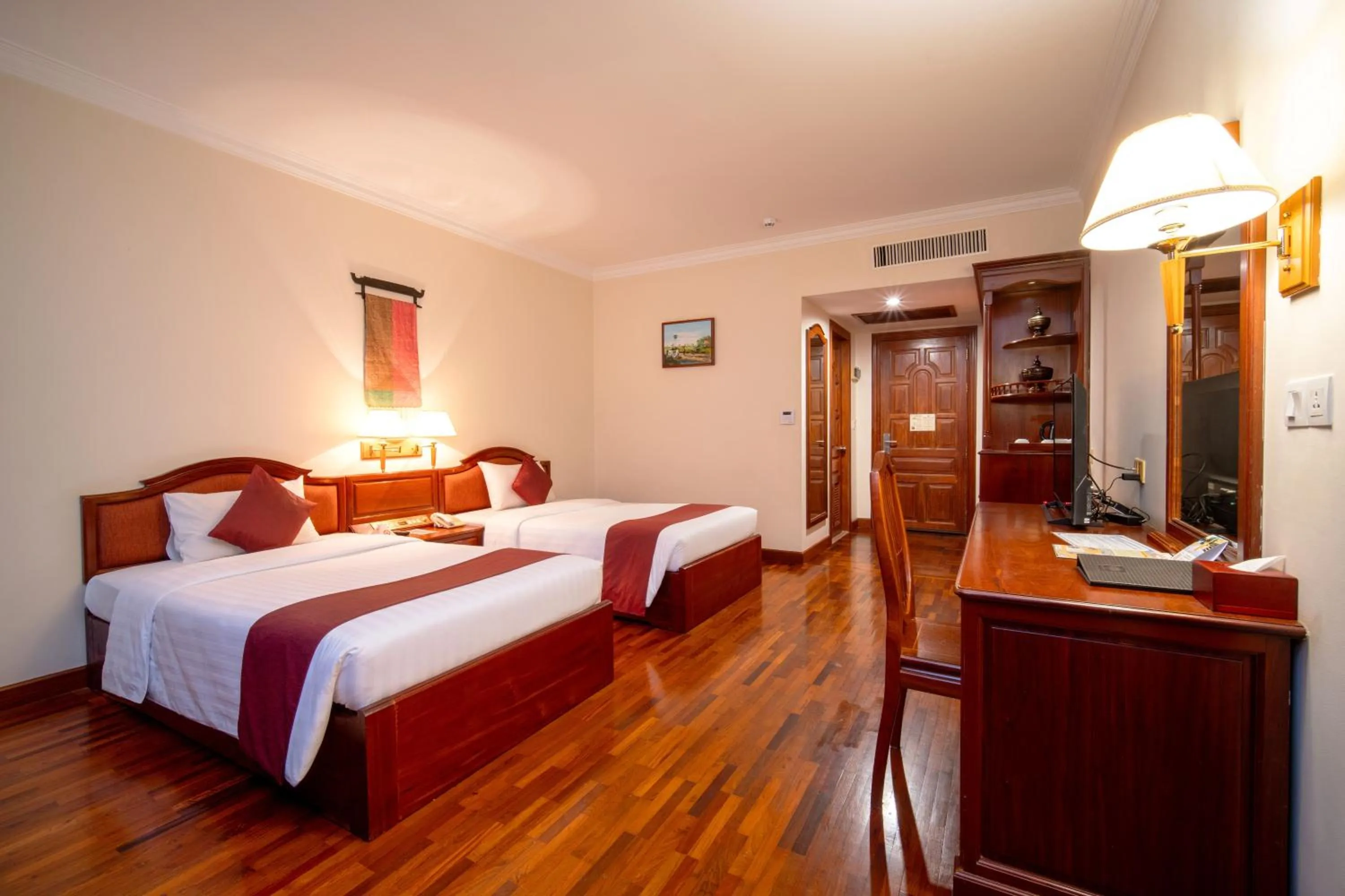 Bed in Khemara Angkor Hotel & Spa