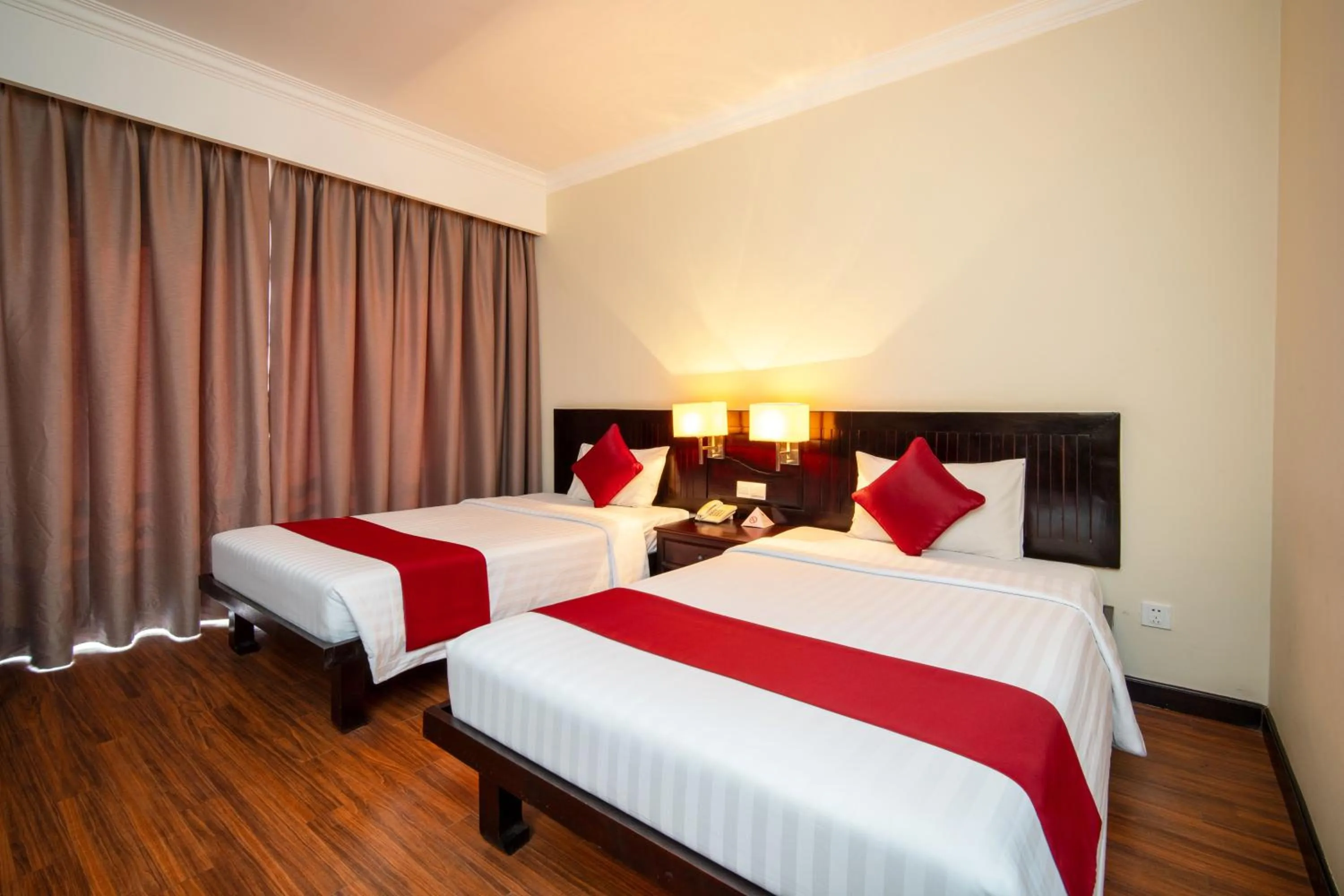 Bed in Khemara Angkor Hotel & Spa