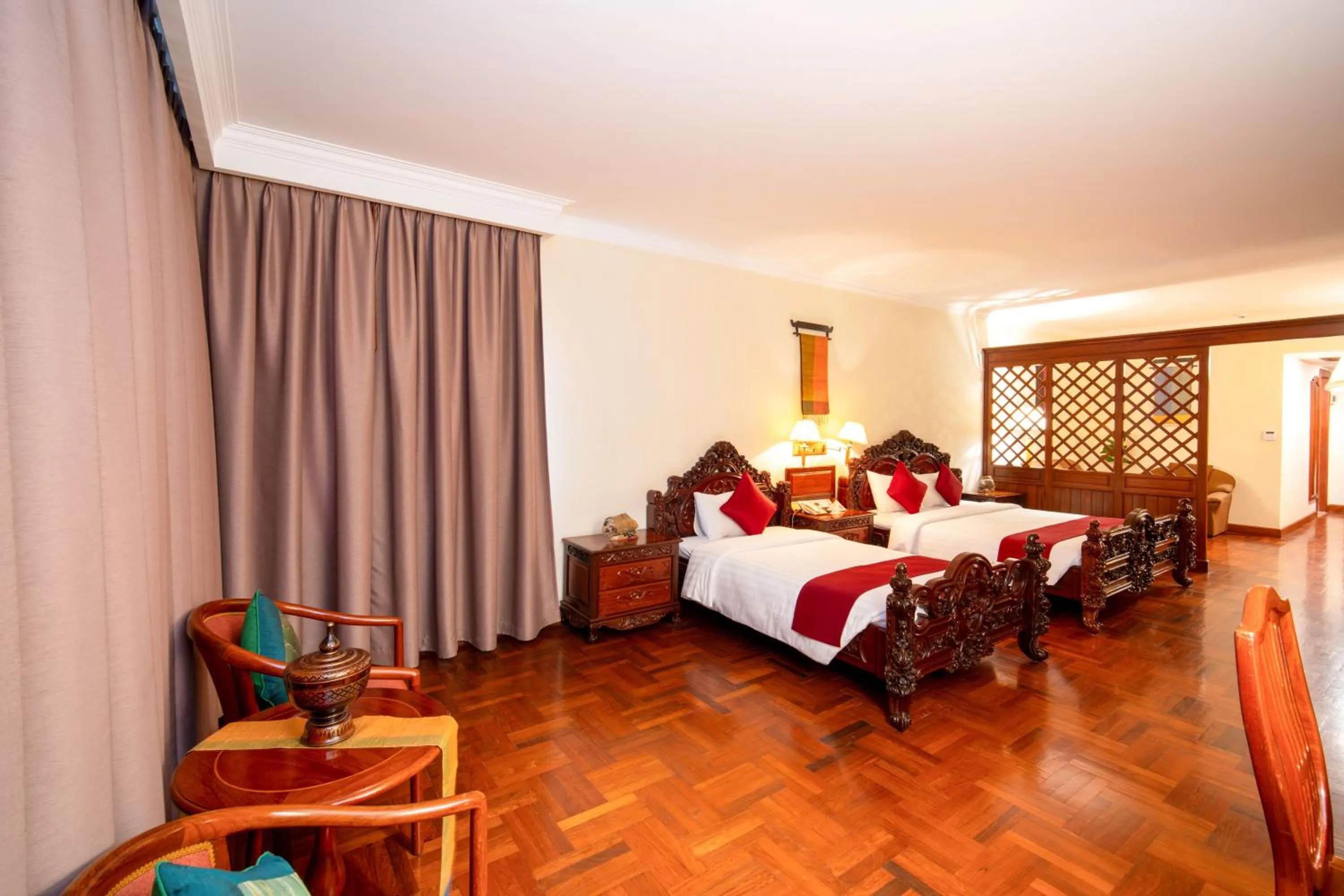 Bed in Khemara Angkor Hotel & Spa