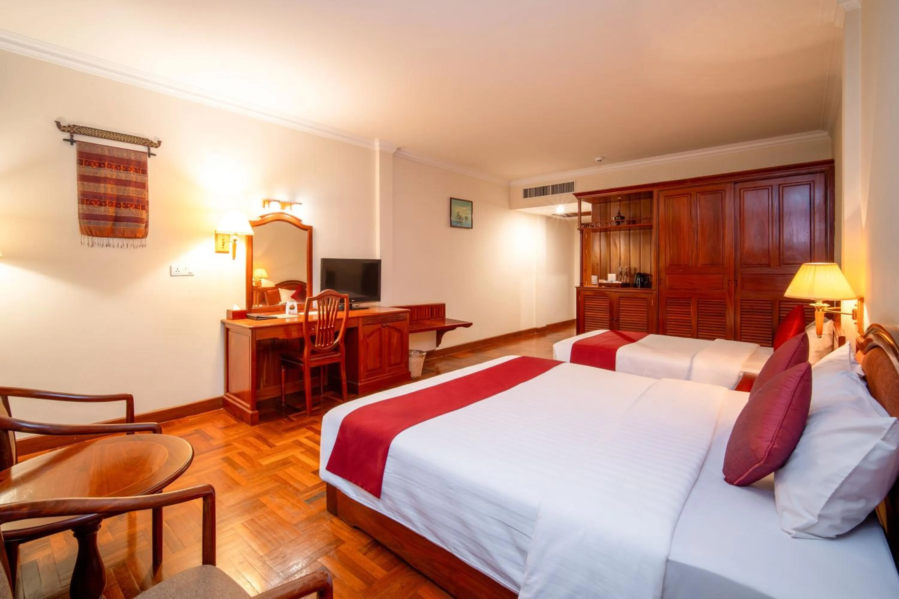 Bed in Khemara Angkor Hotel & Spa