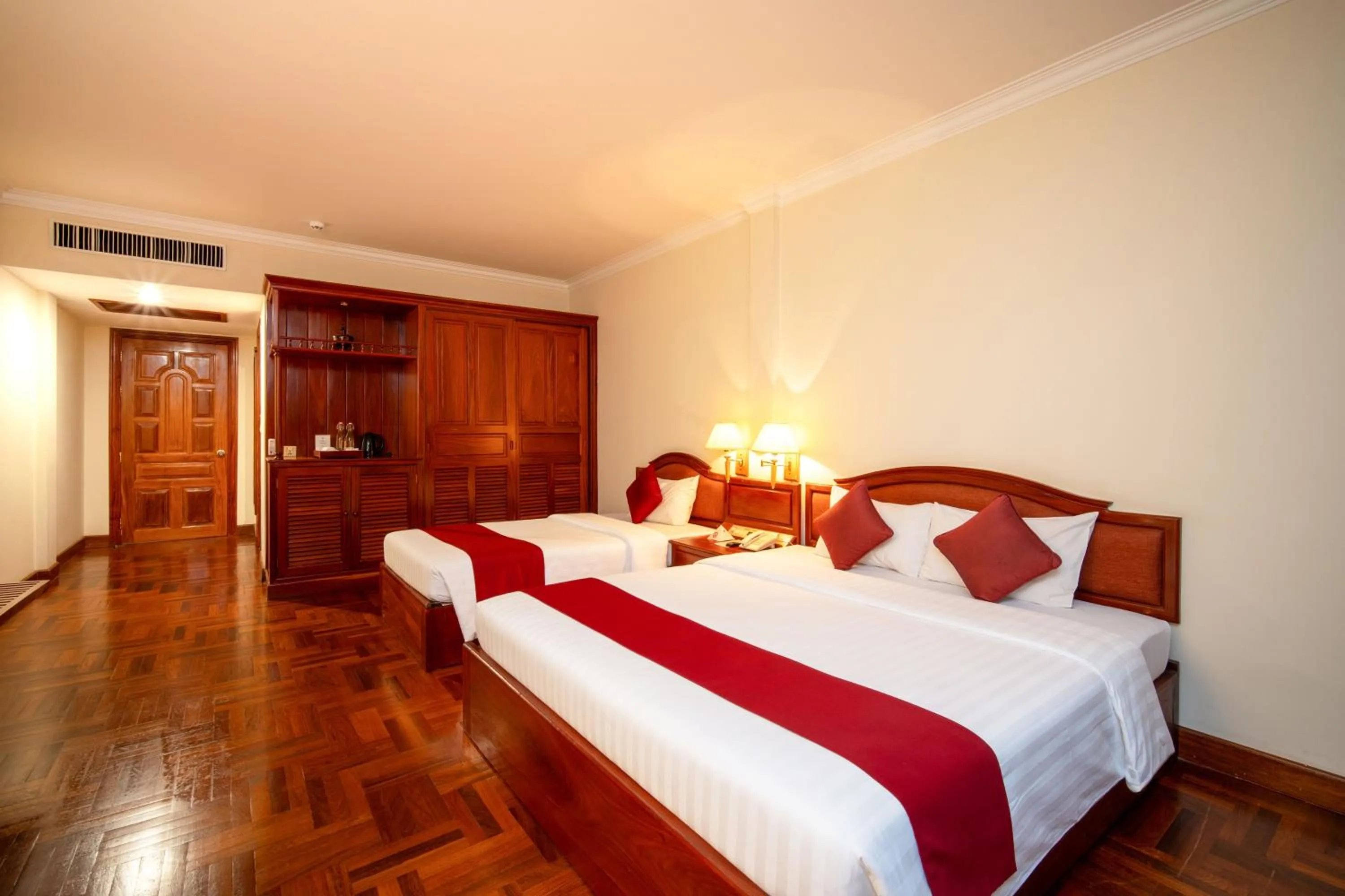 Bed in Khemara Angkor Hotel & Spa