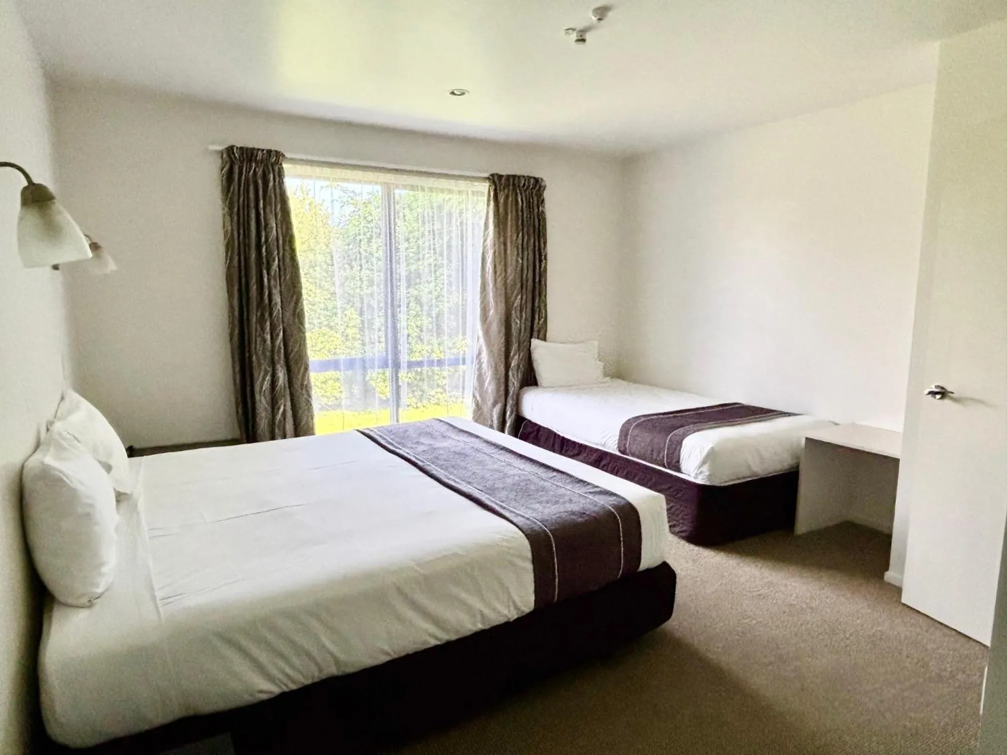 Bed in ASURE Phoenix Motor Inn