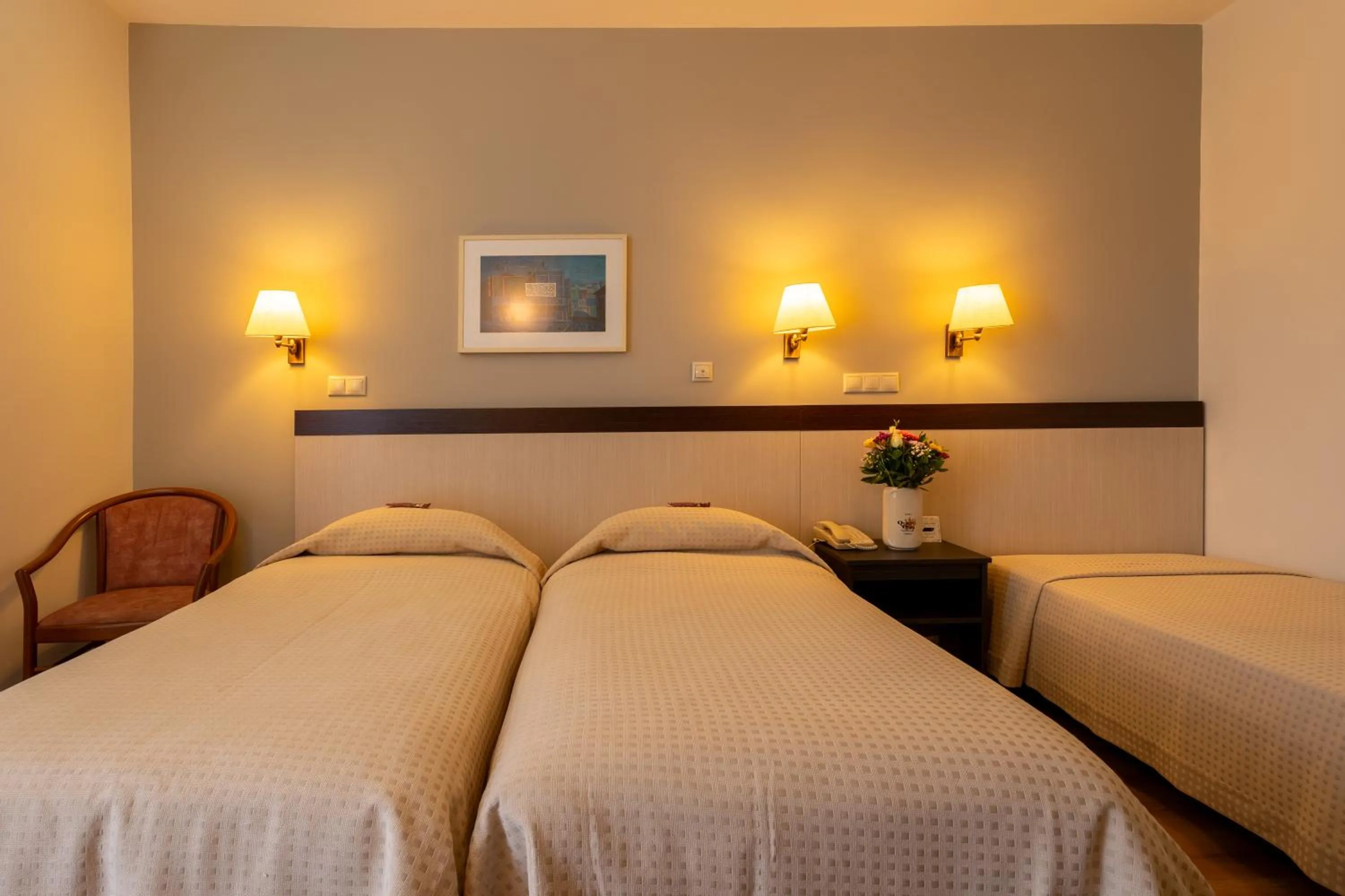 Bed in Queen Olga Hotel