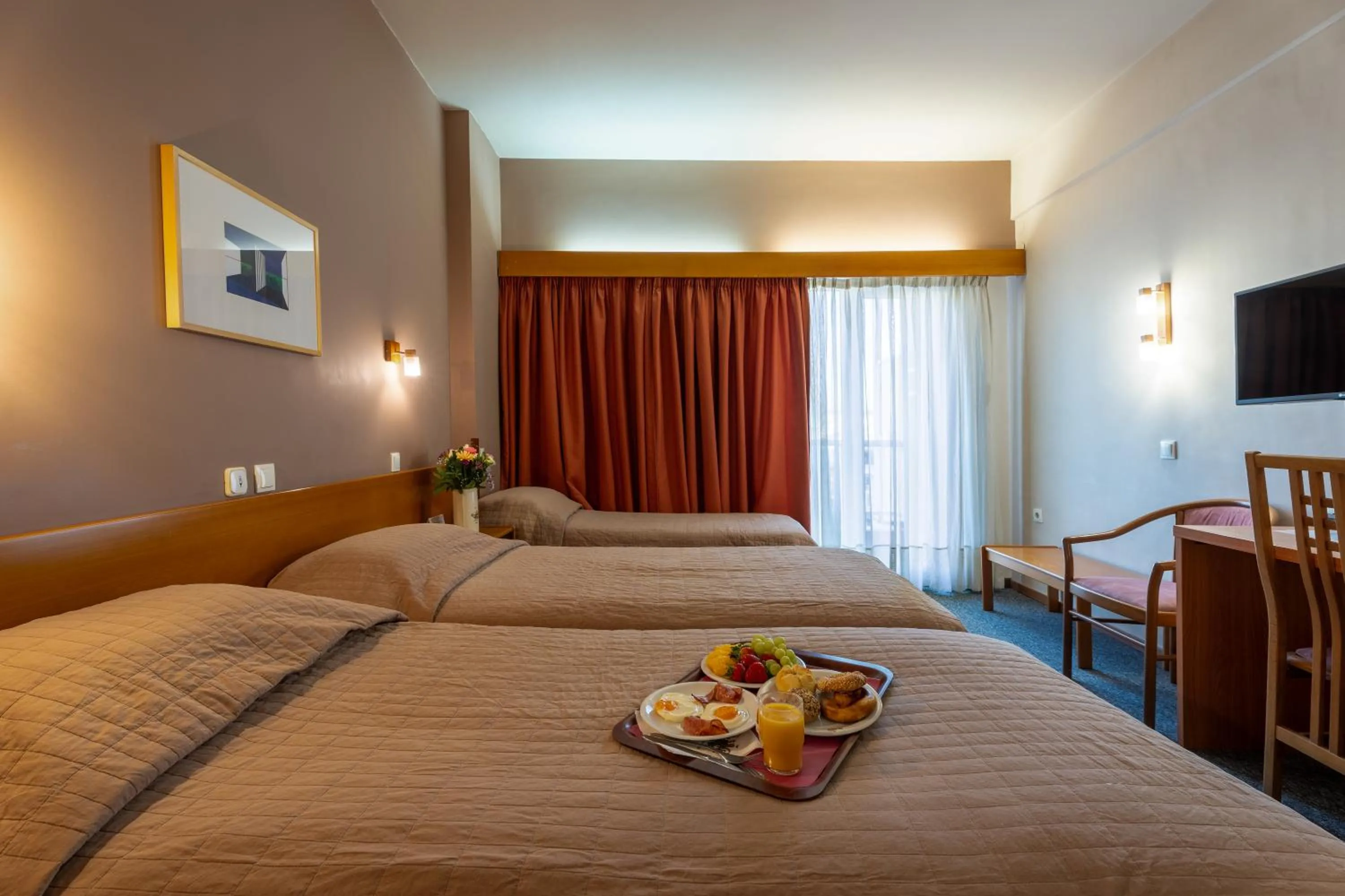 Bed in Queen Olga Hotel